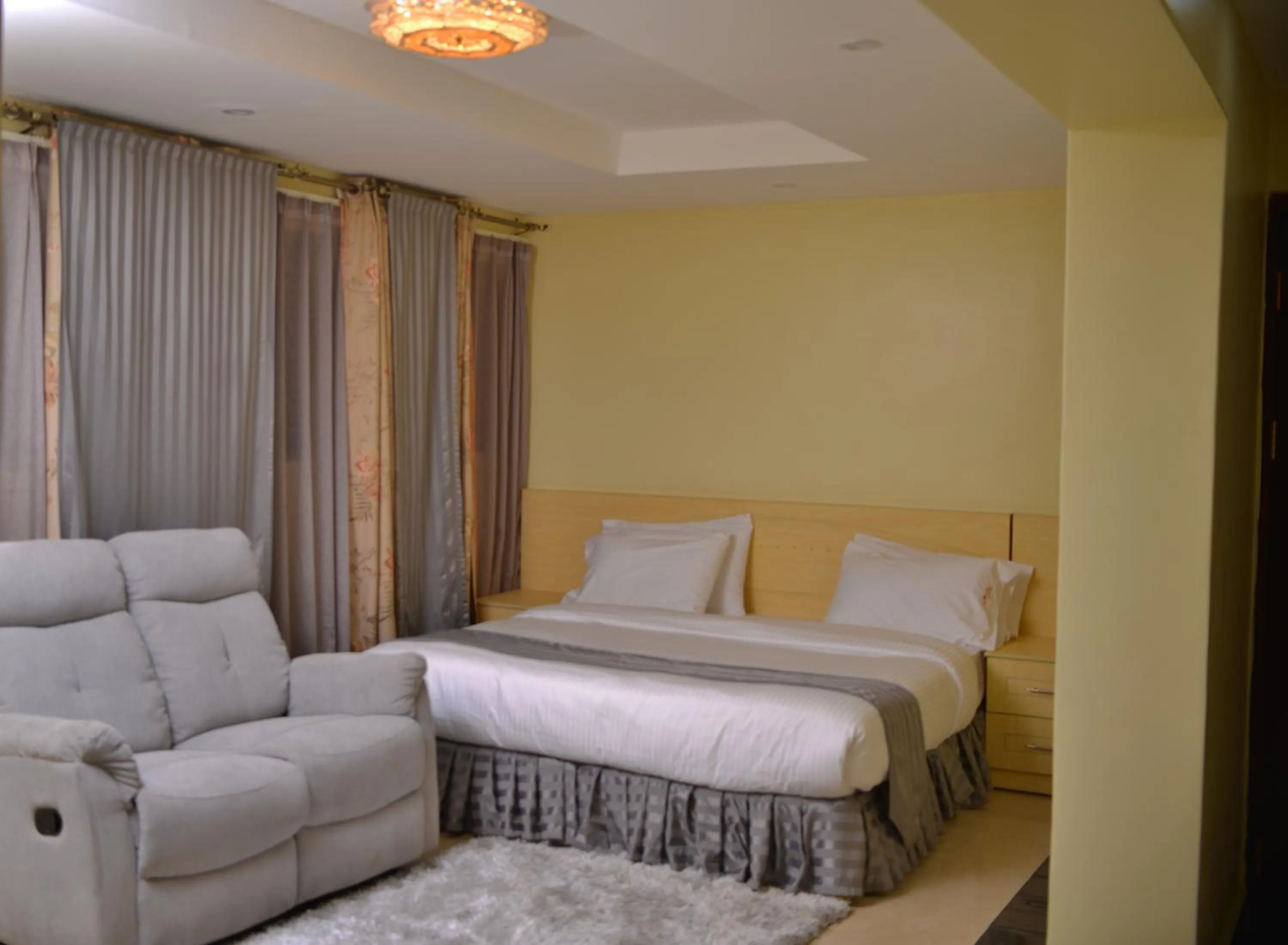 Bedroom, Bed in Crystal Suites & Apartments