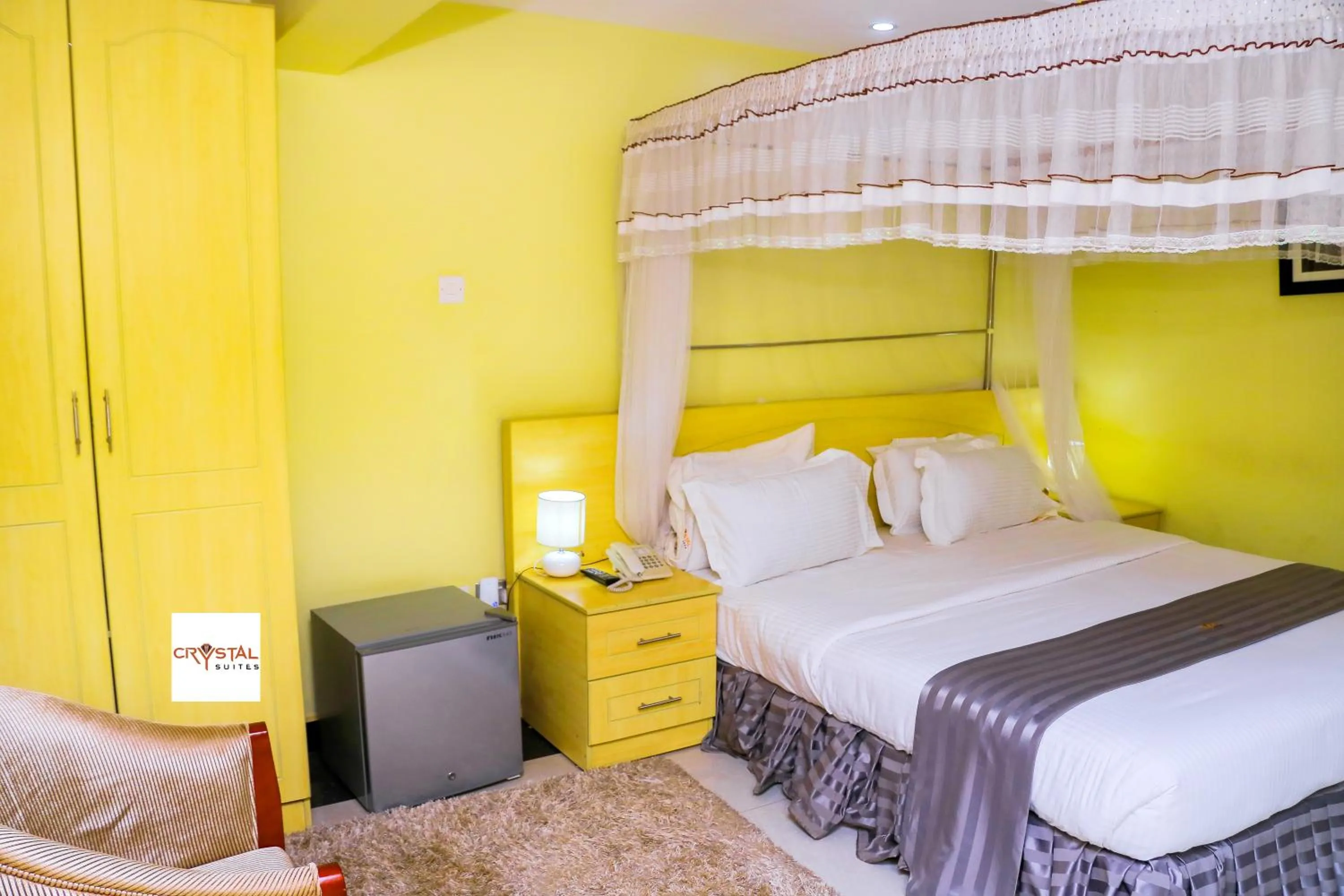 Bed in Crystal Suites & Apartments