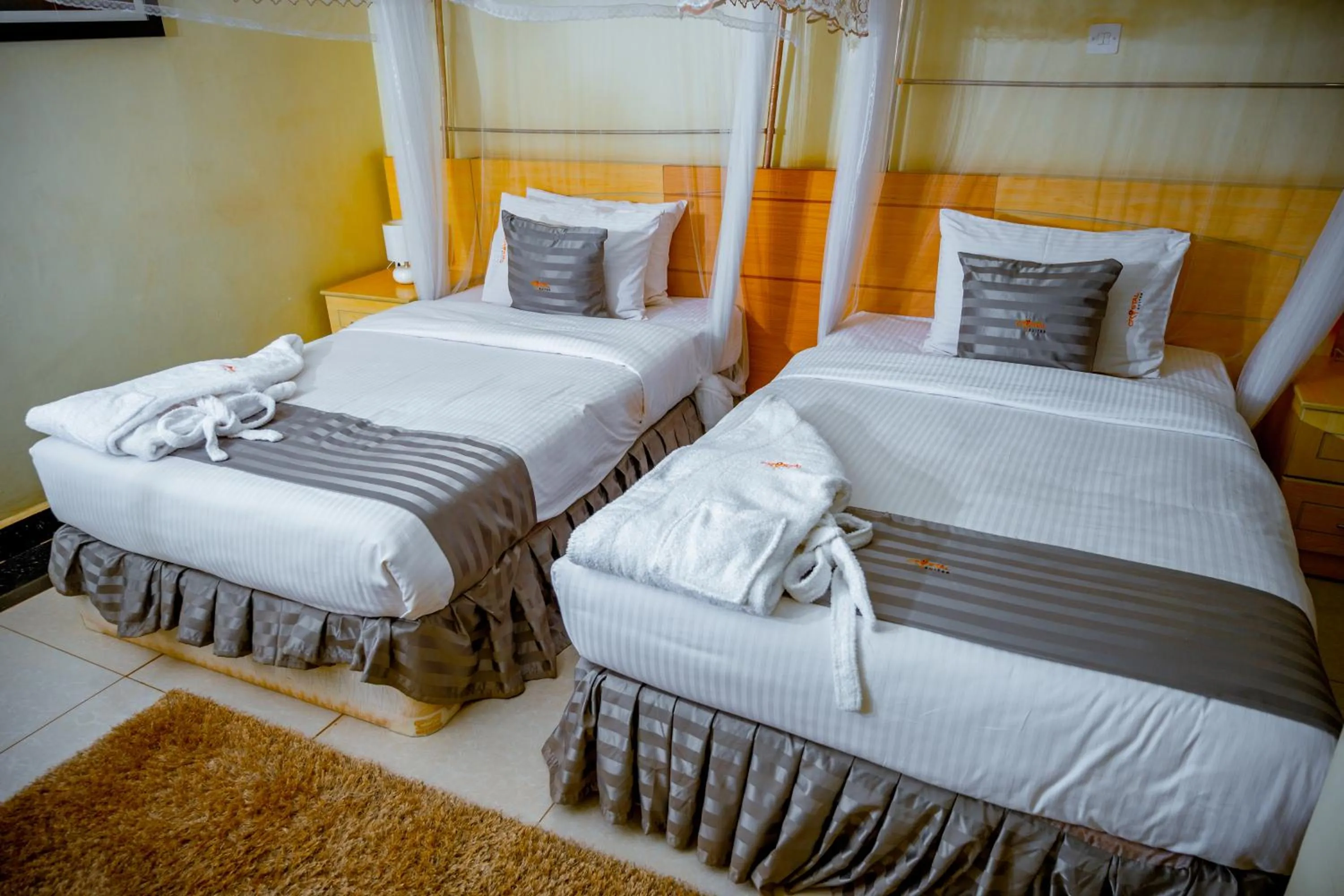 Bedroom, Bed in Crystal Suites & Apartments