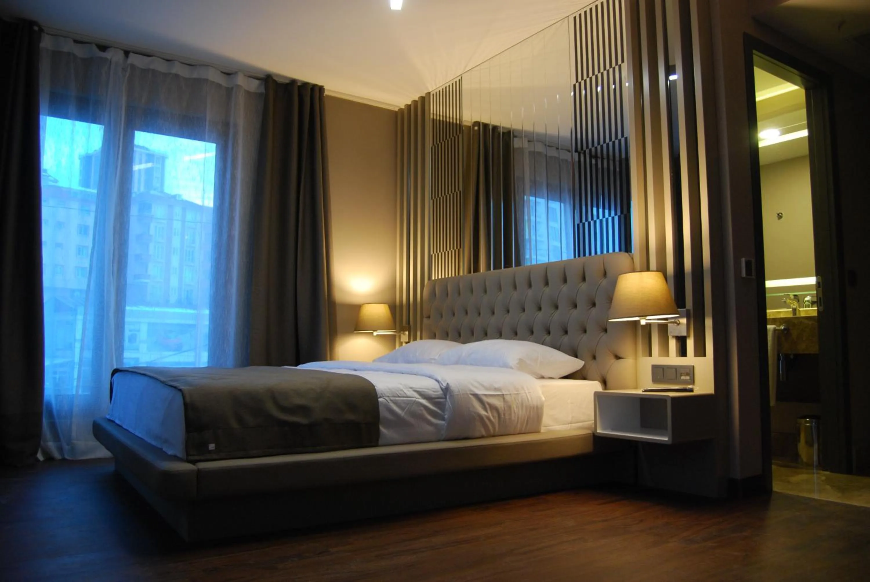Photo of the whole room, Bed in The City Suites
