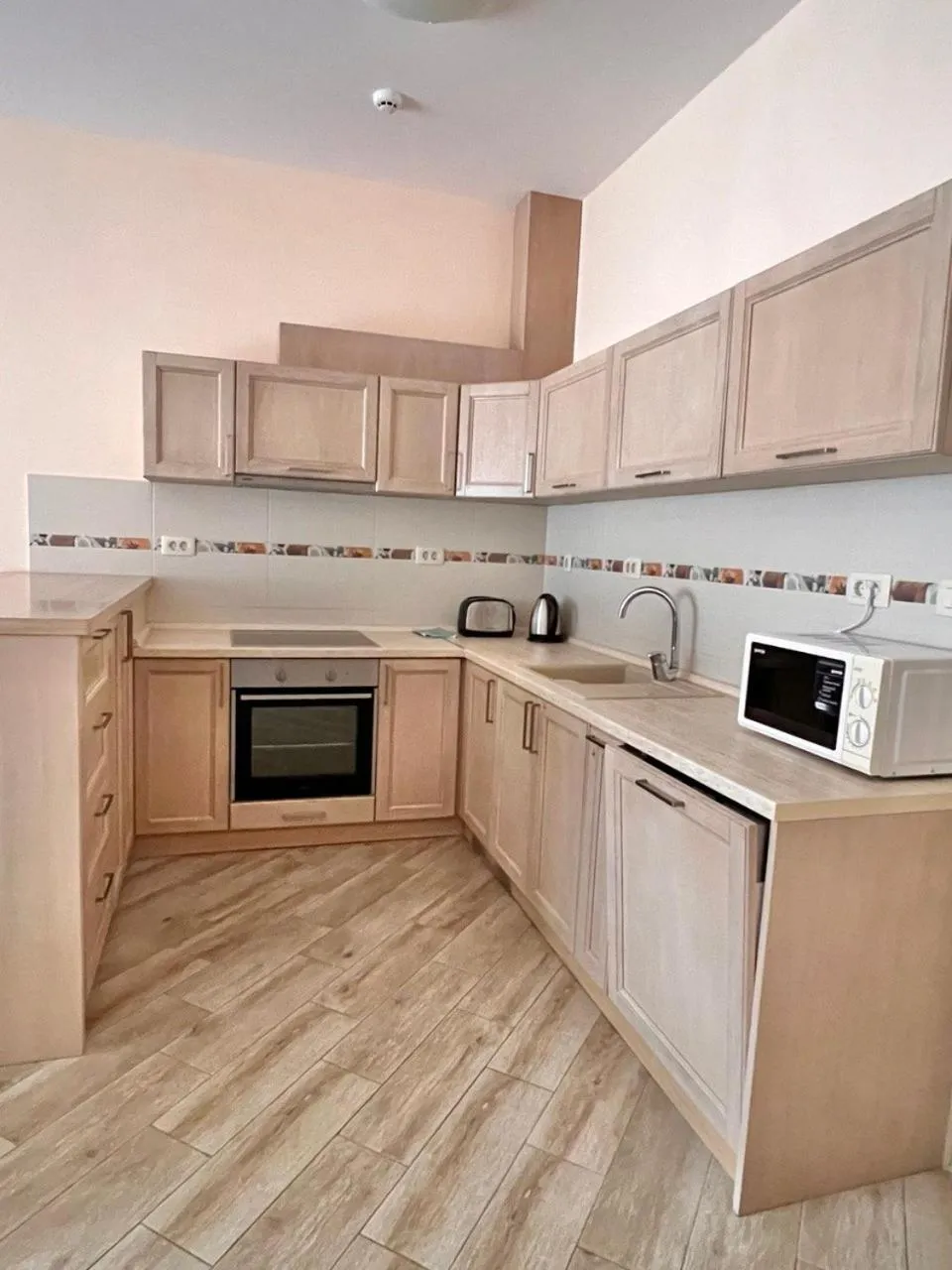 Kitchen or kitchenette in ApartHotel Belvedere Residence Becici Budva