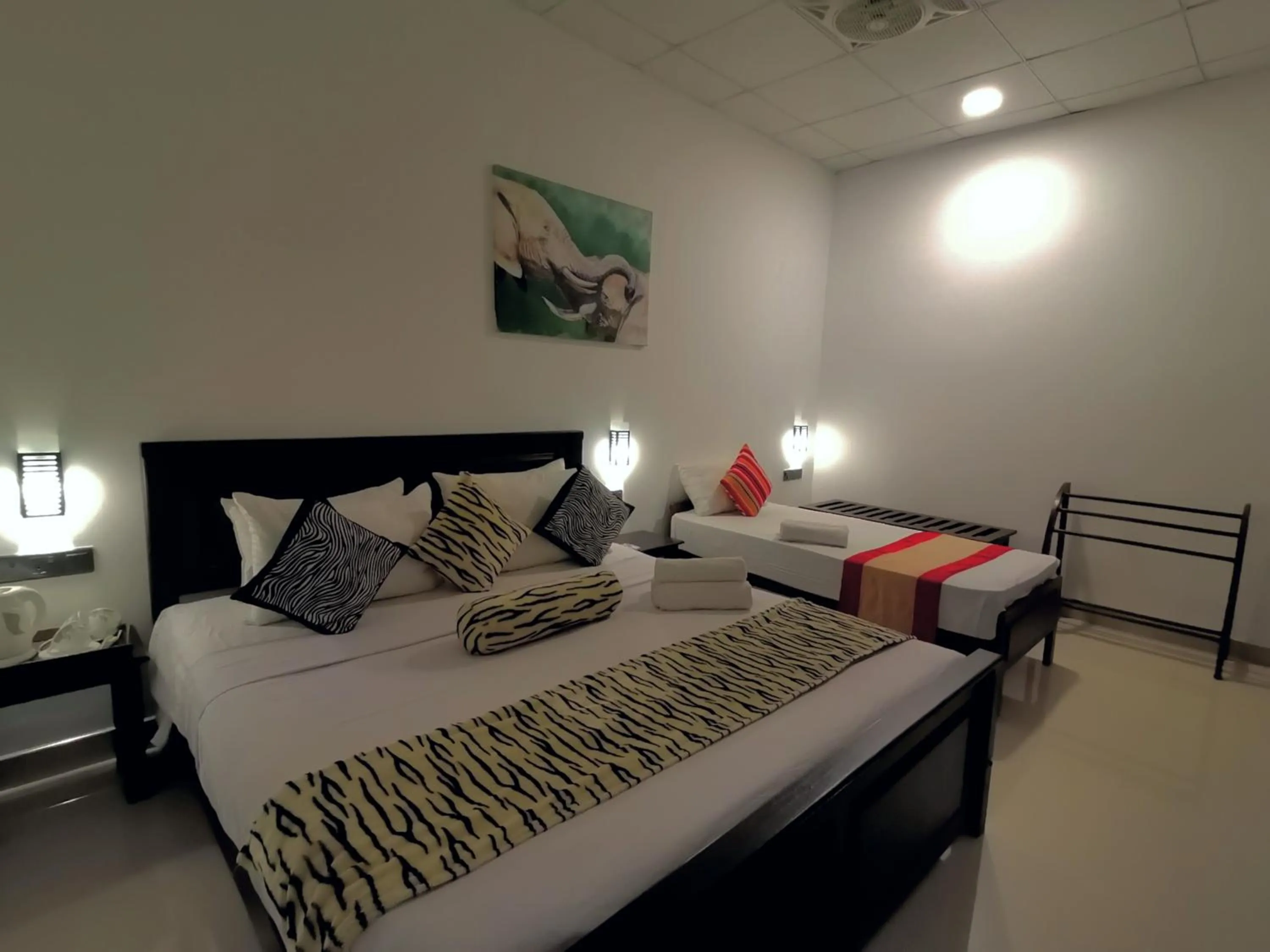 Bed in Levona Garden Resort