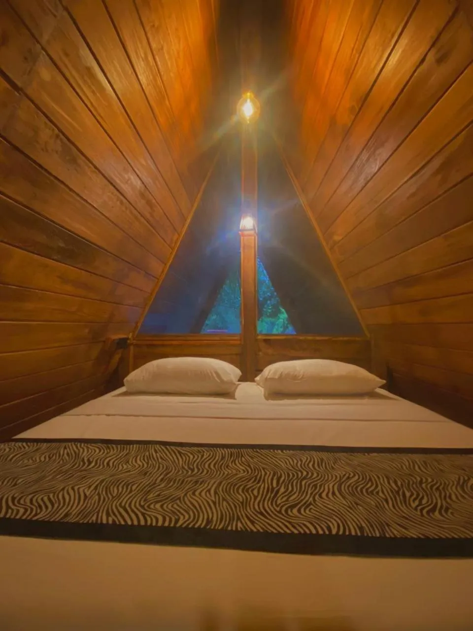 Bed in Levona Garden Resort