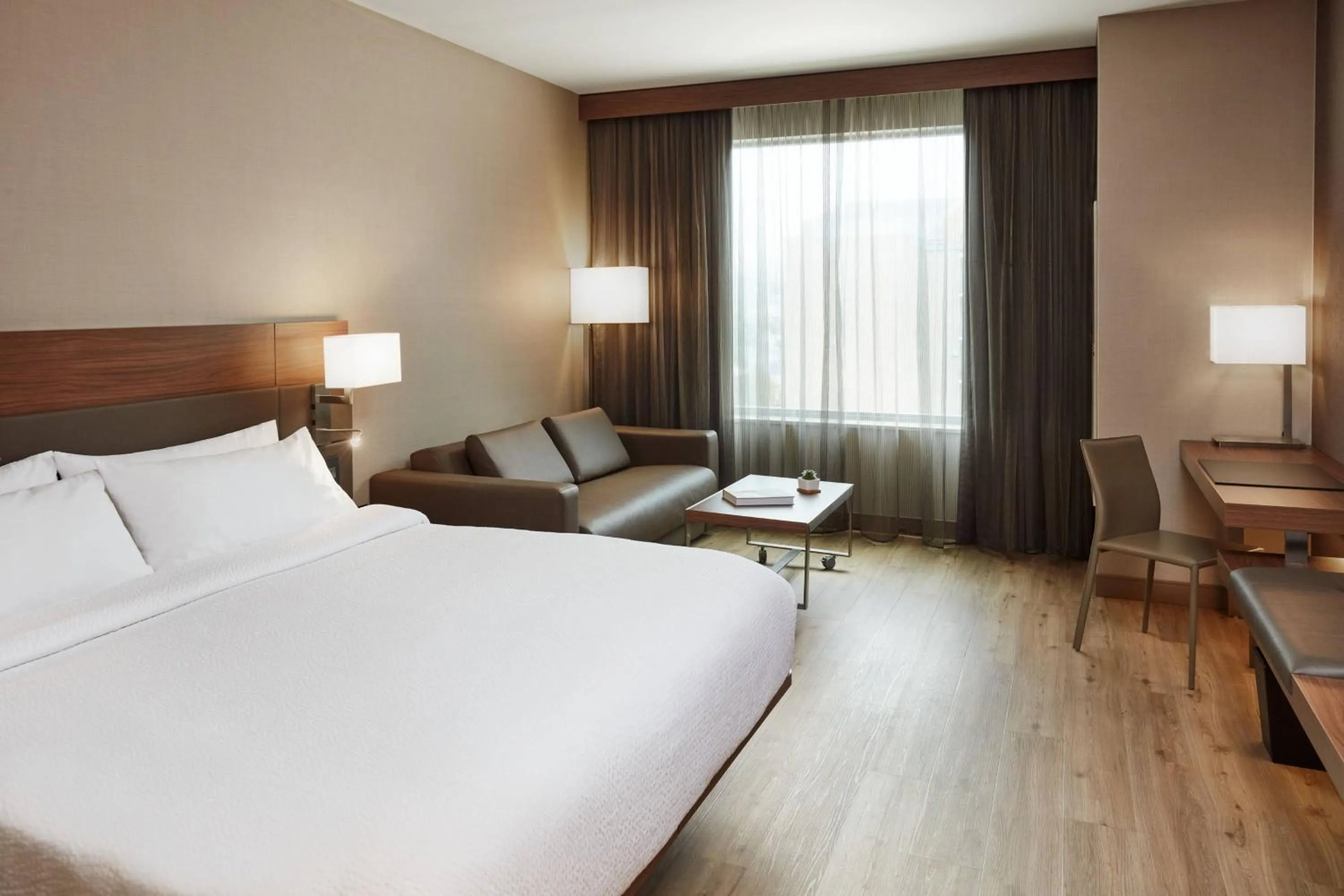 Photo of the whole room, Bed in AC Hotel by Marriott Cincinnati at The Banks