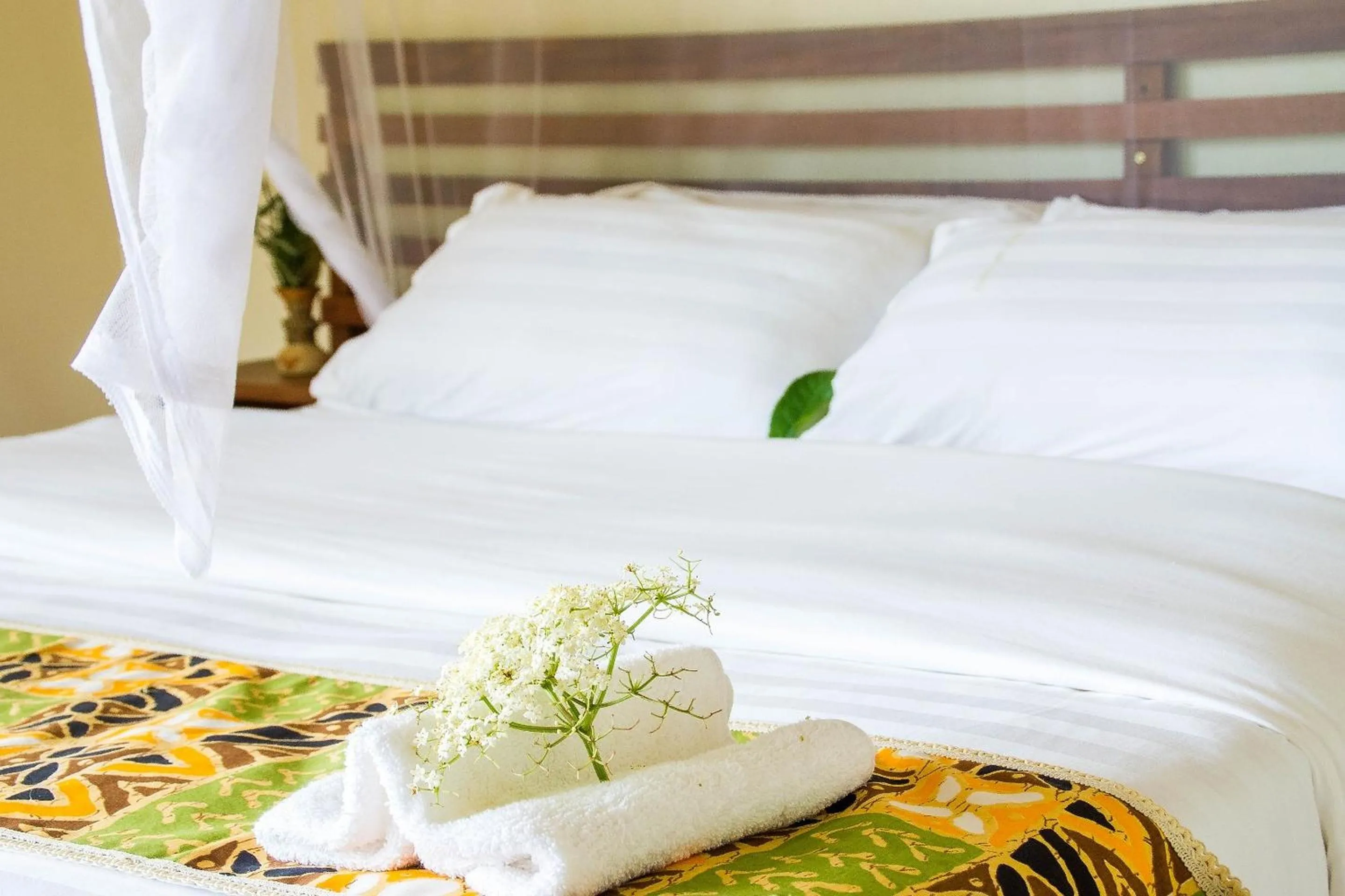 Bed in Ichumbi Gorilla Lodge