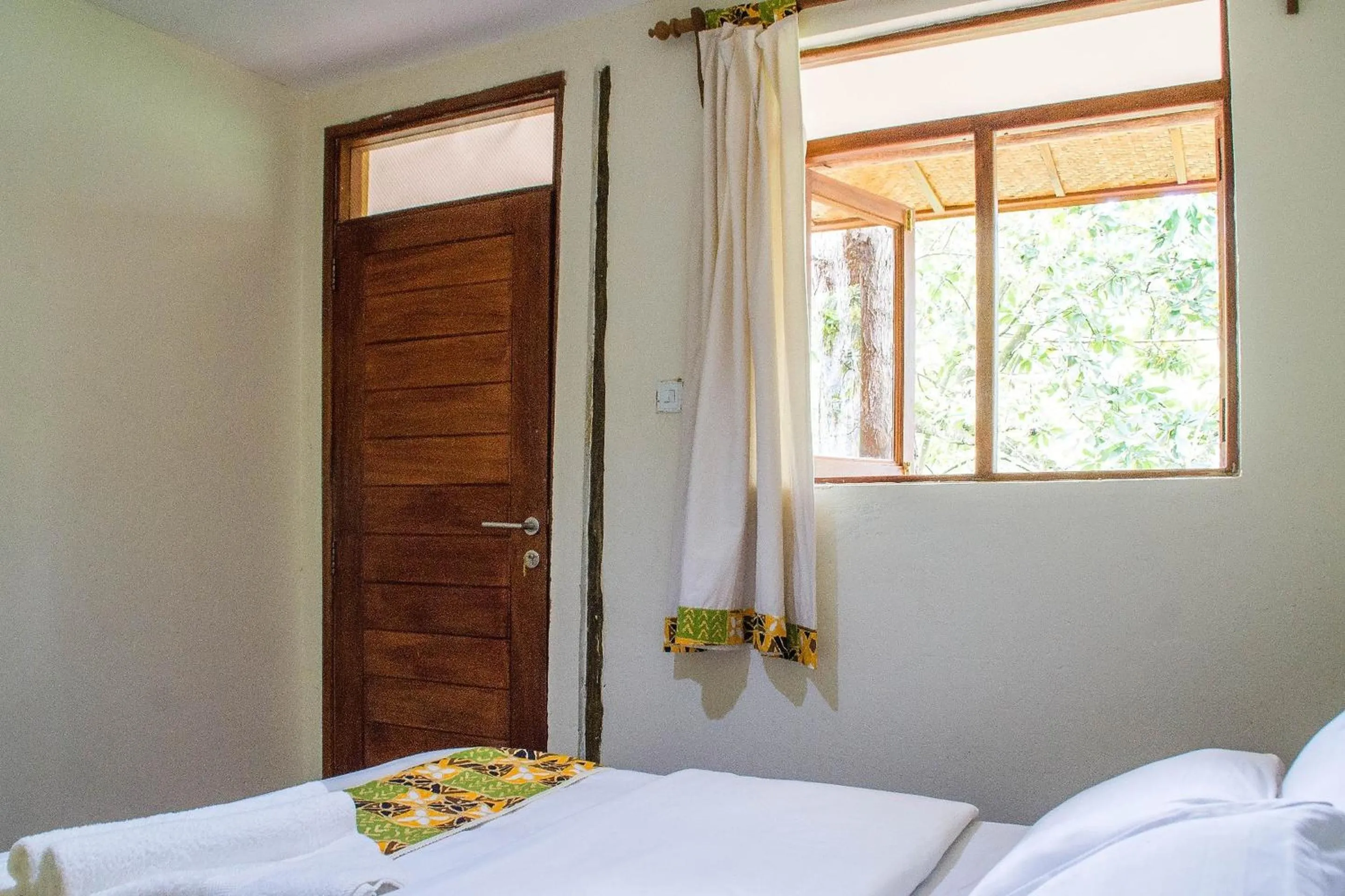 Bed in Ichumbi Gorilla Lodge