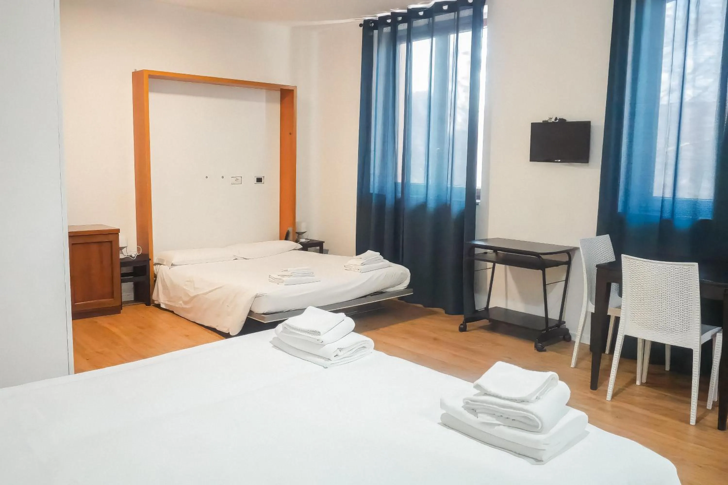 Bed in La Boheme SMART Hotel