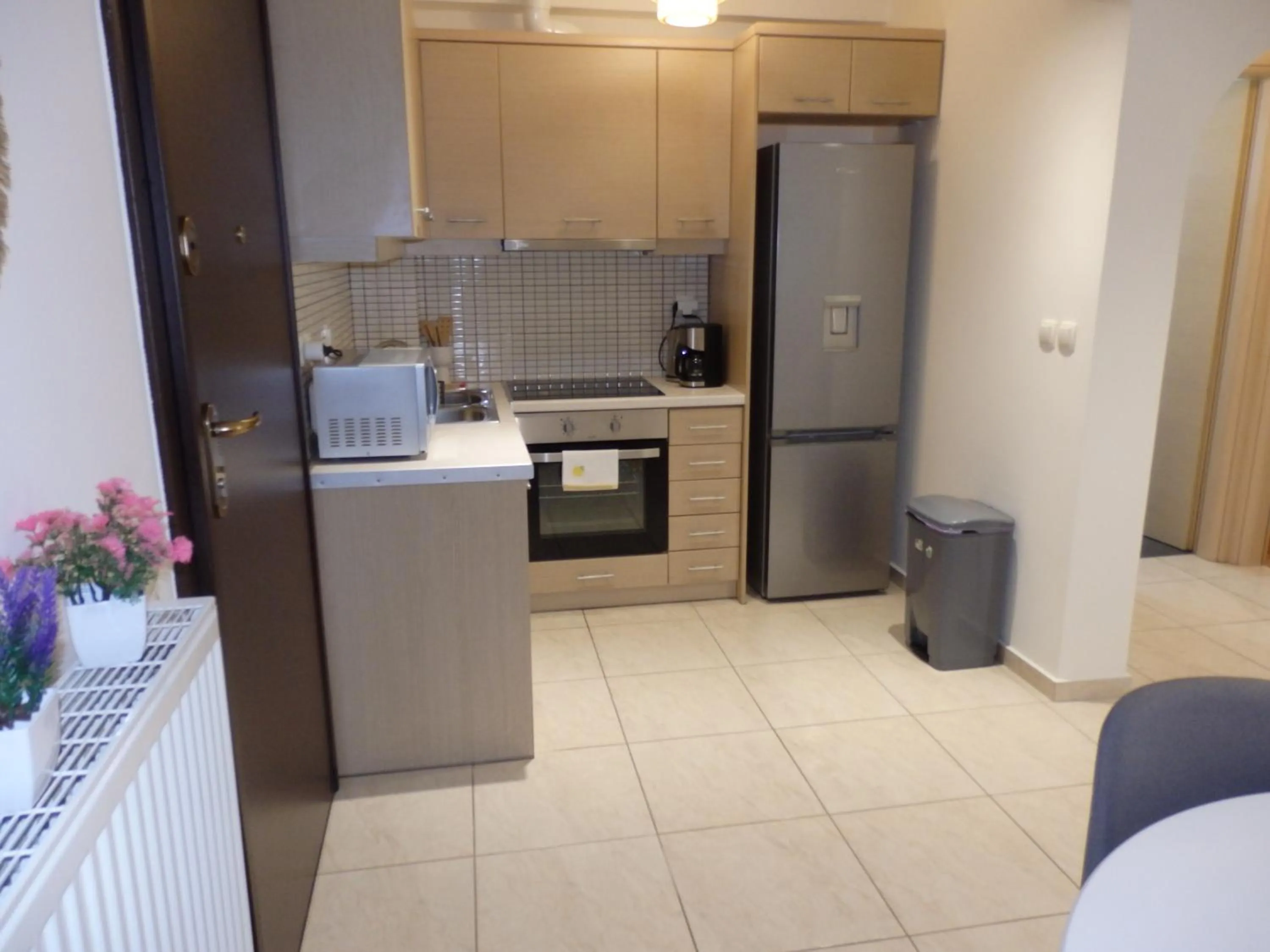 kitchen in A&J Apartments or Rooms athens airport