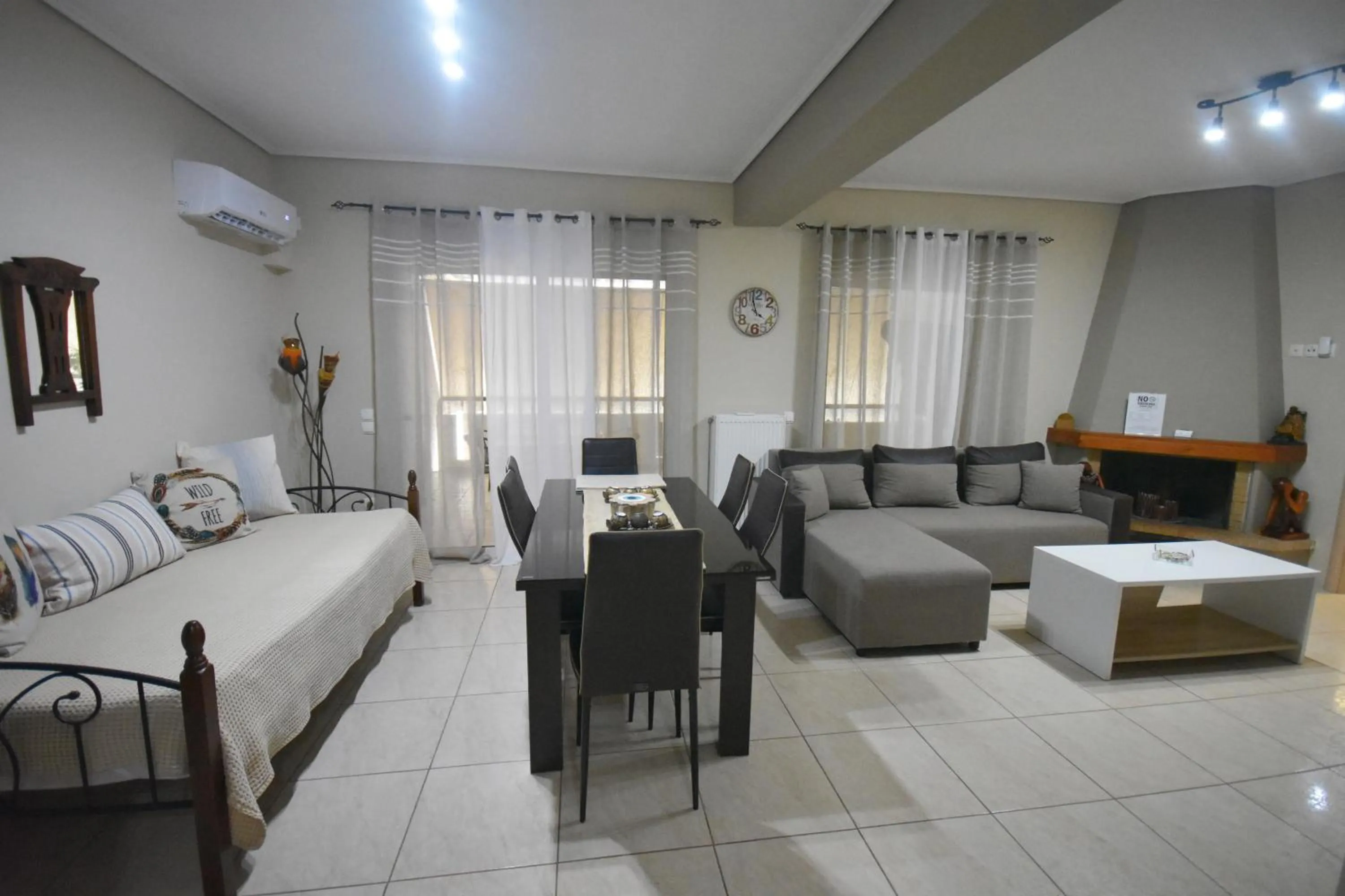 Living room, Bed in A&J Apartments or Rooms athens airport