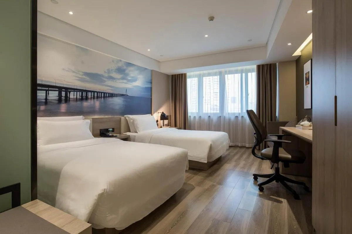 Bed in Ningbo Tianyi Square Atour Hotel