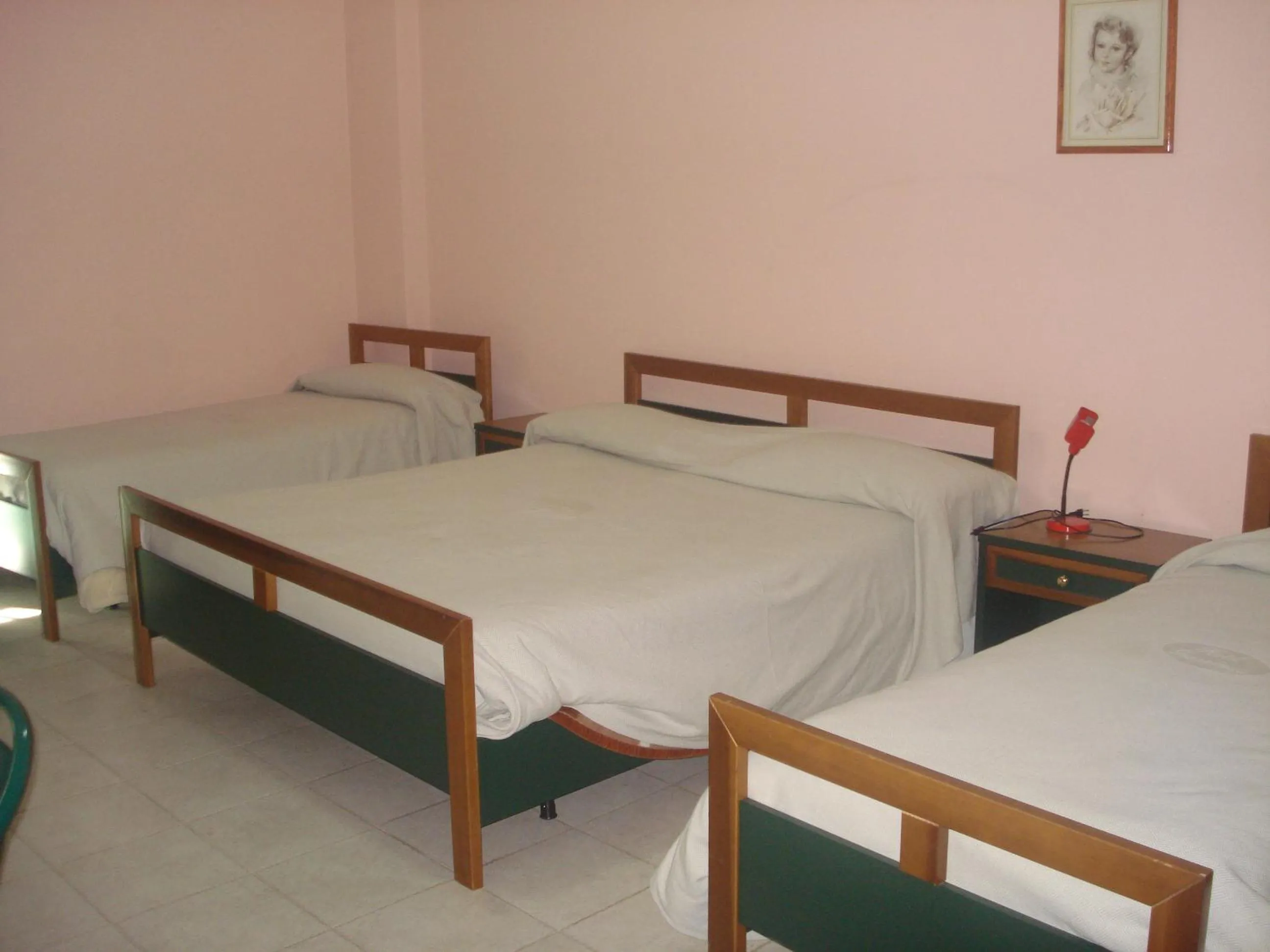 Property building, Bed in Hotel Grandinetti