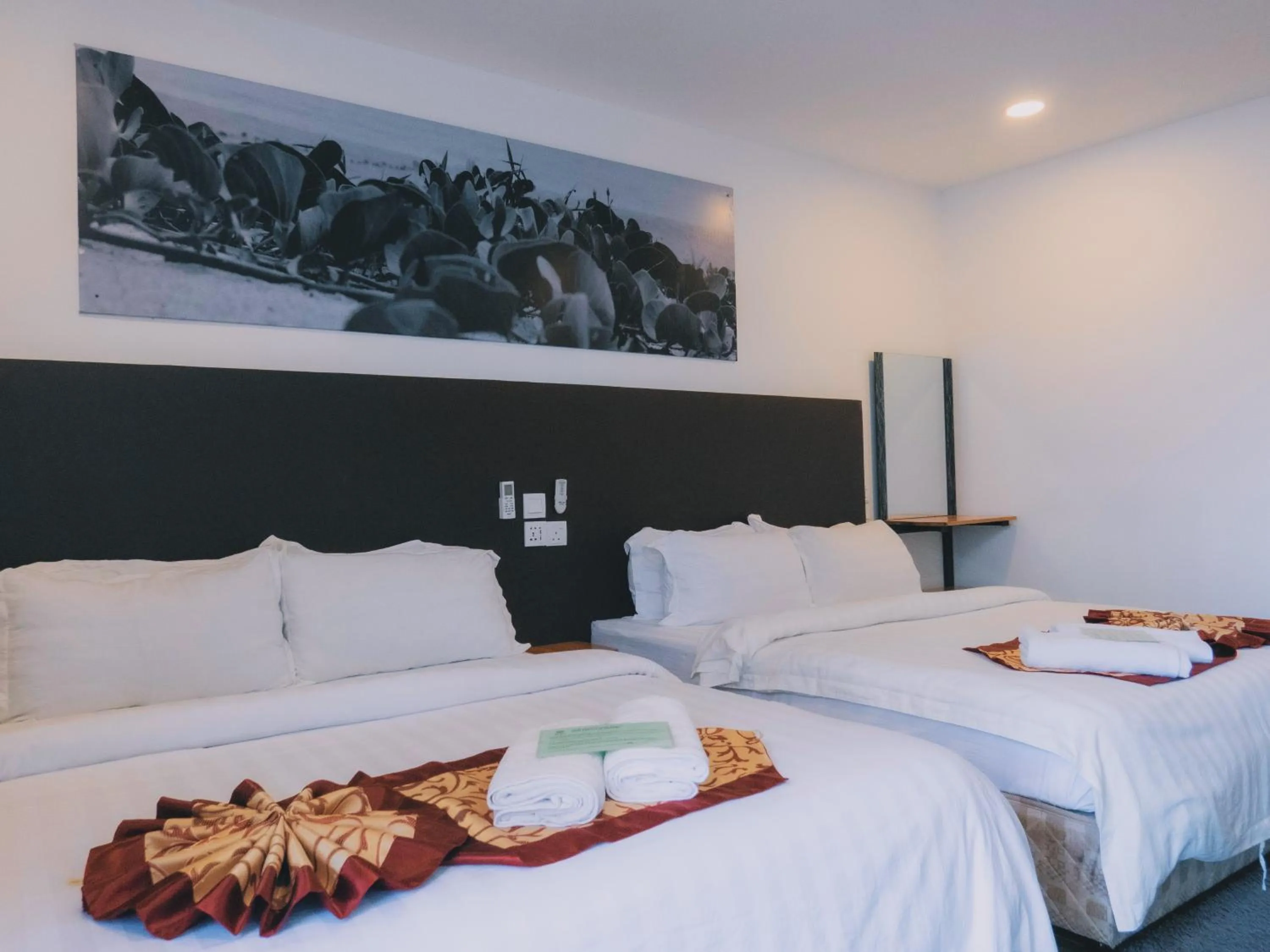 Bed in The Barat Tioman Beach Resort