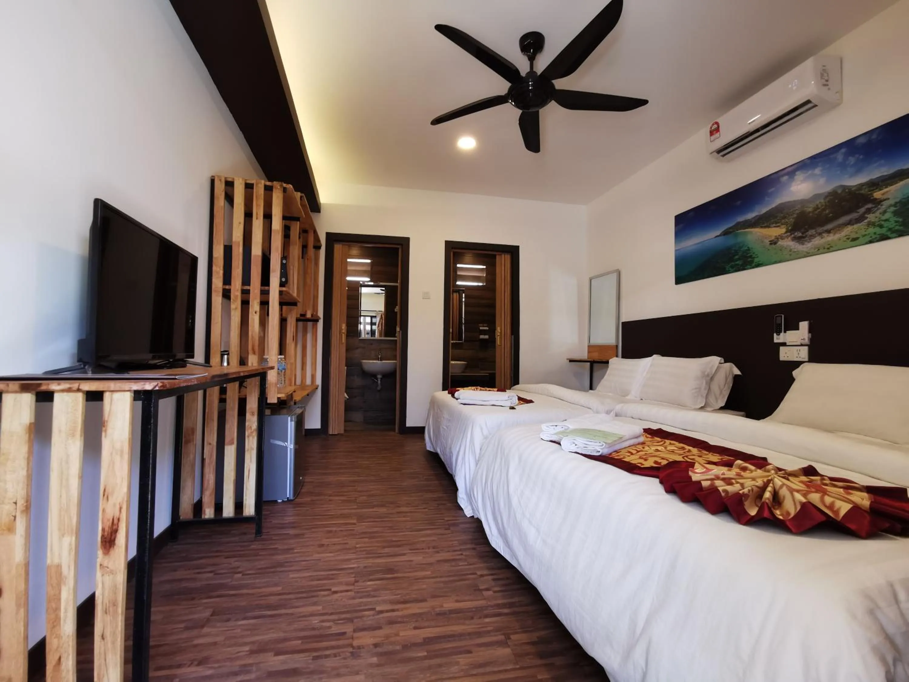 Bed in The Barat Tioman Beach Resort