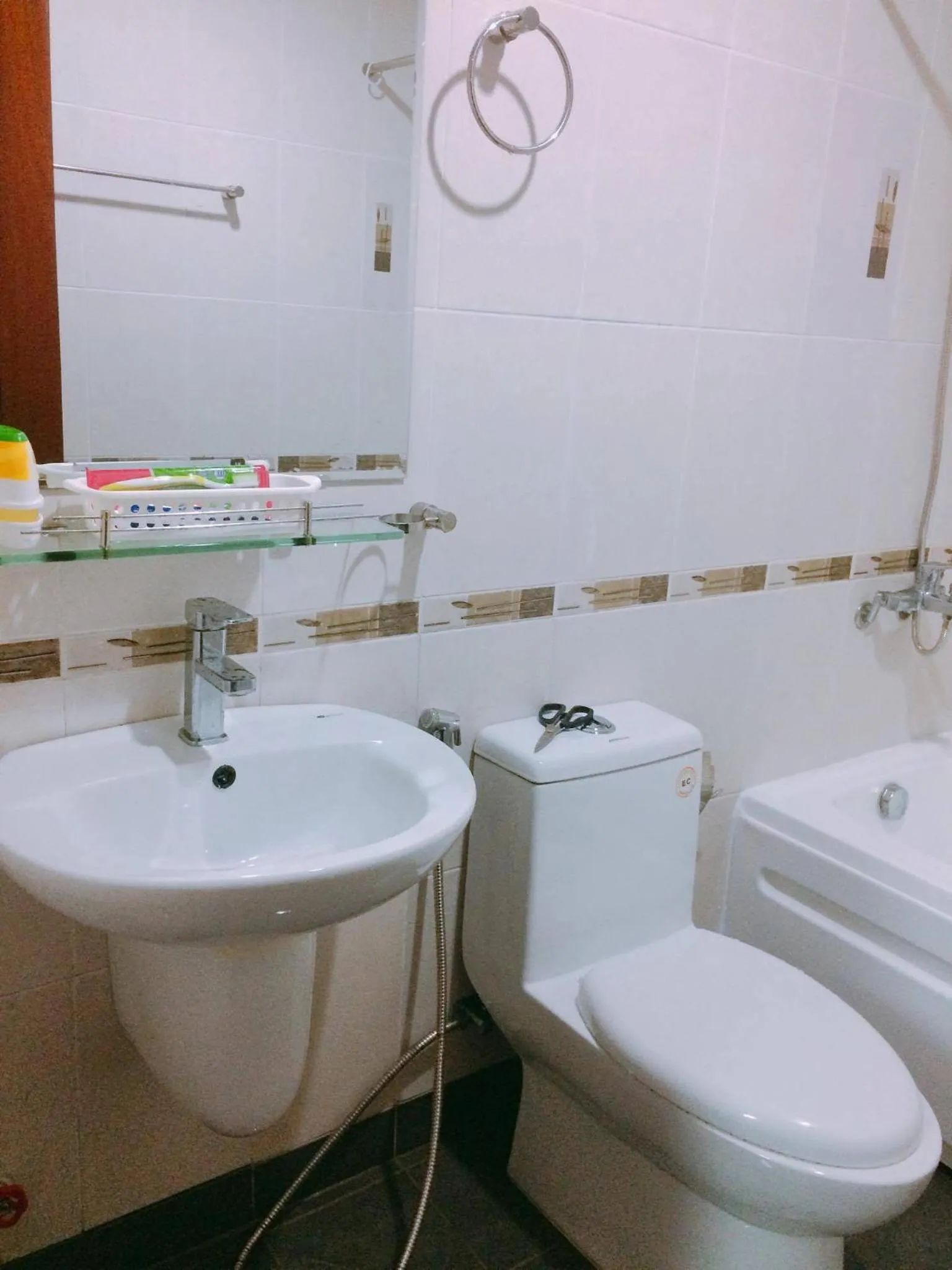 Toilet in Chillax Apartment - Cozy 3-Bedroom City View Home at Tower, District 1