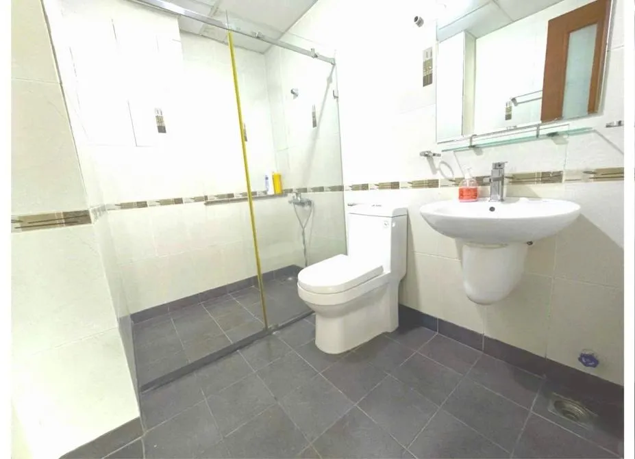 Shower in Chillax Apartment - Cozy 3-Bedroom City View Home at Tower, District 1