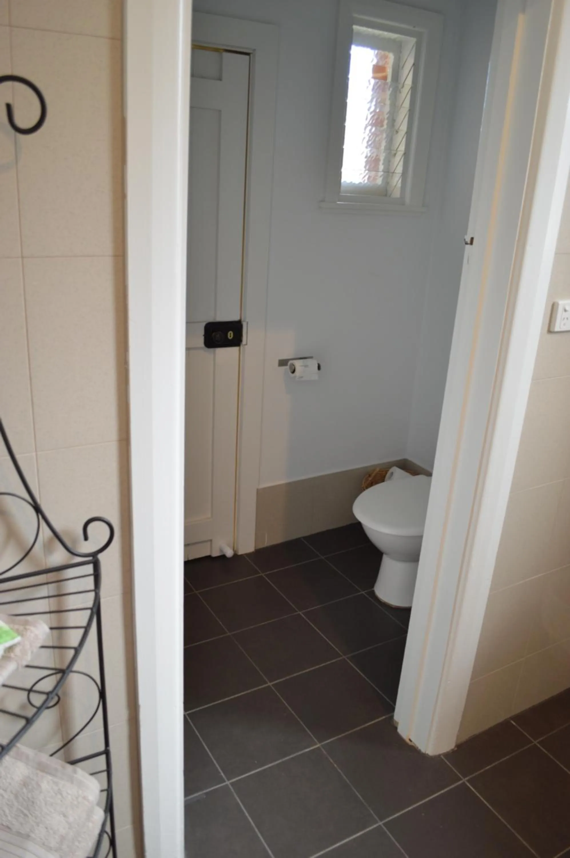 Toilet in Two Cow Cottage Bed & Breakfast