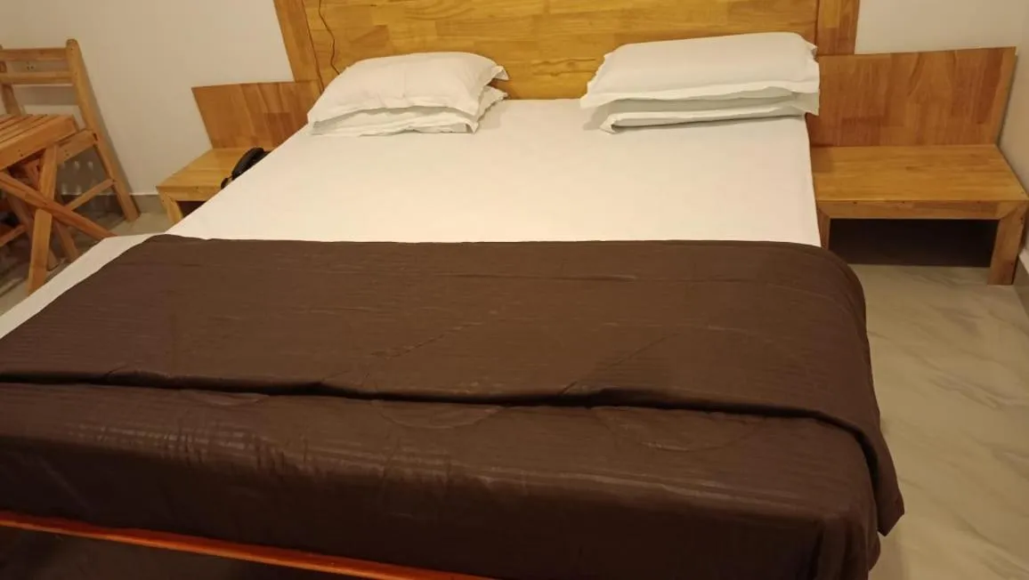 Bed in Coconhuts Beach Resort