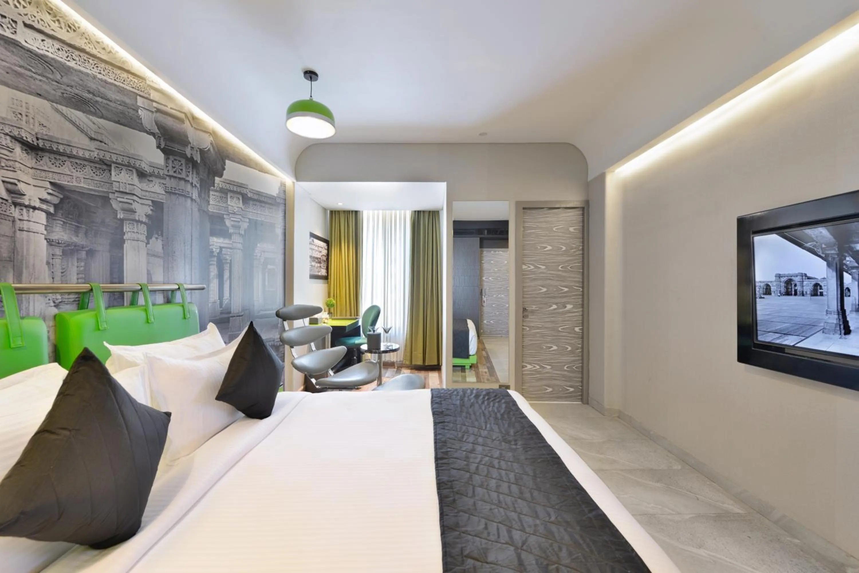 Photo of the whole room, Bed in Regenta Central Antarim Ahmedabad