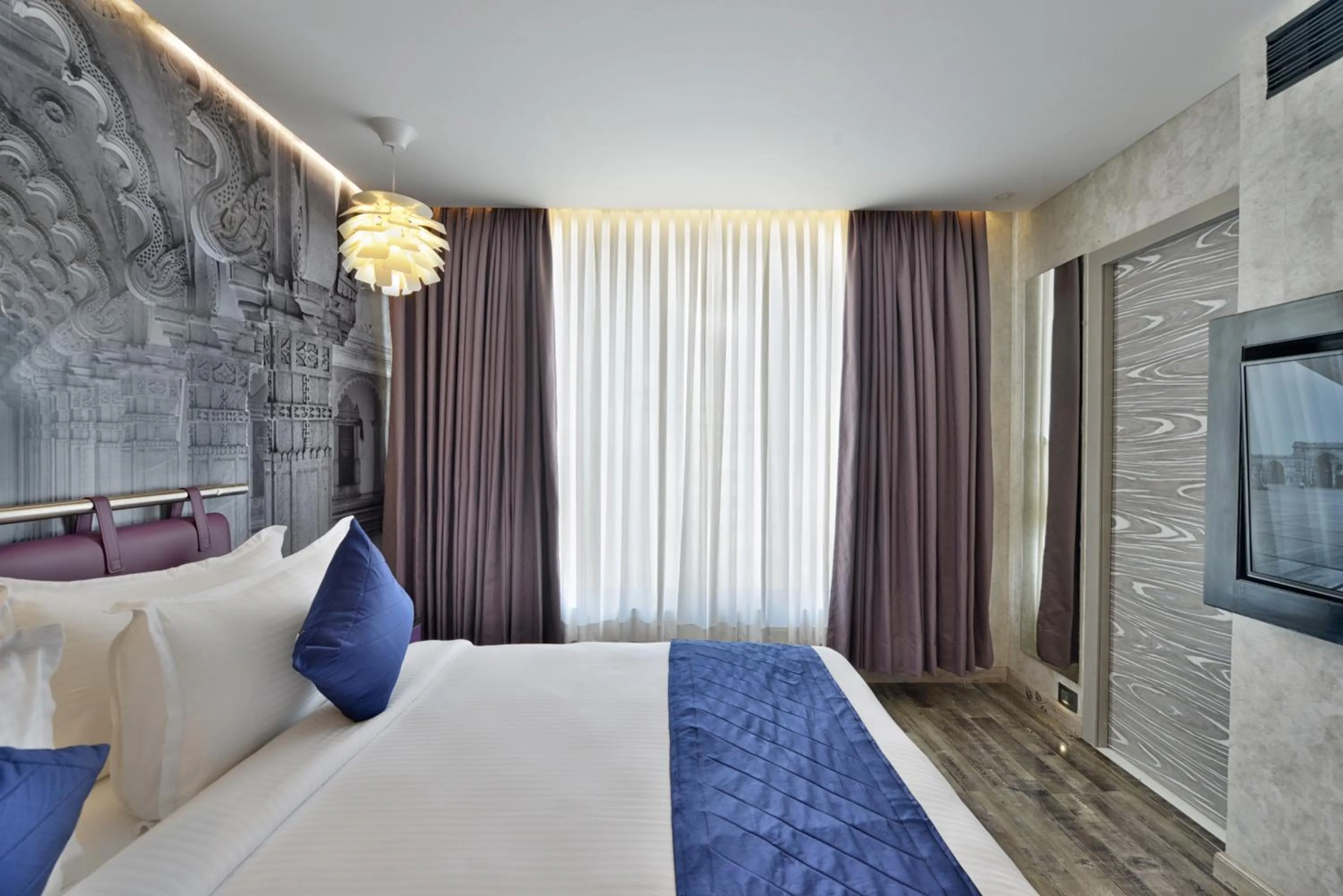 Bed in Regenta Central Antarim Ahmedabad