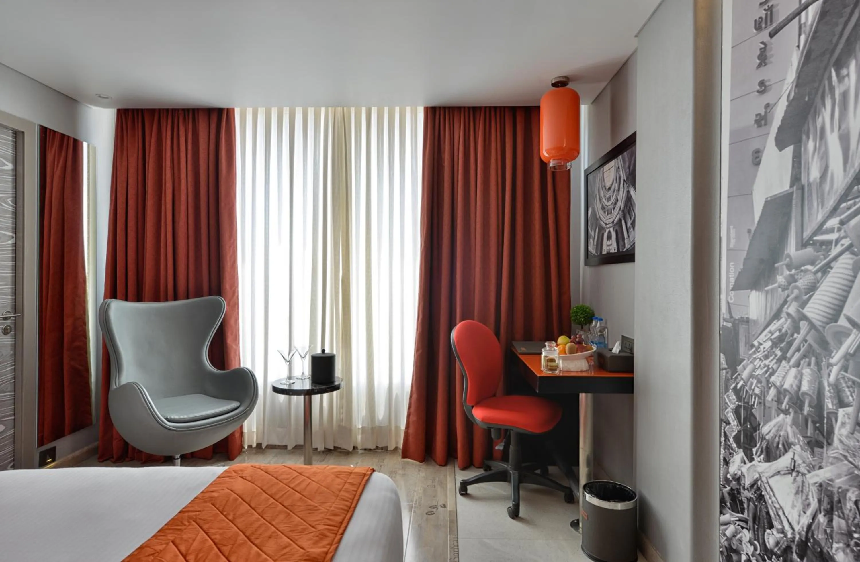 Seating area, Bed in Regenta Central Antarim Ahmedabad