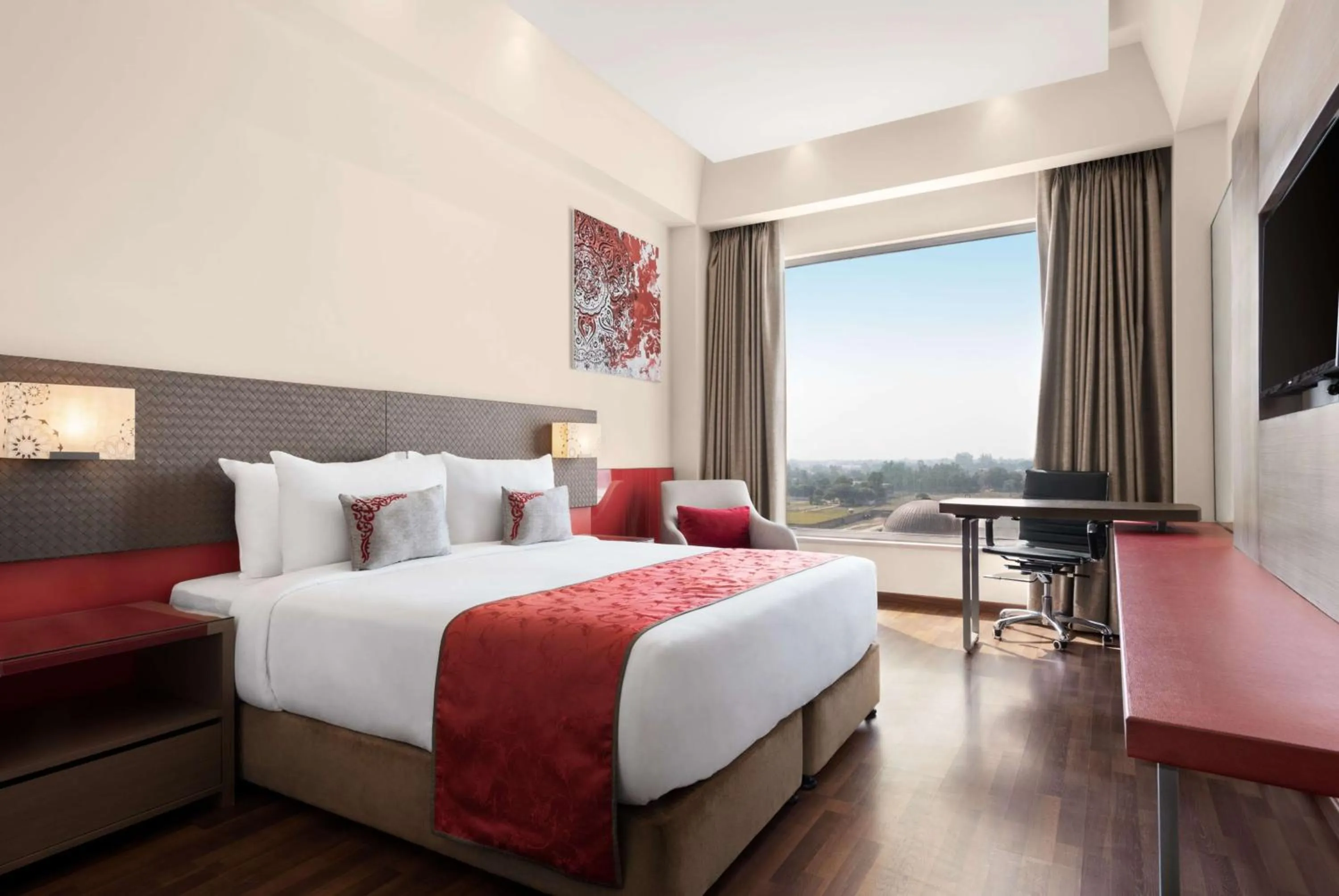 Photo of the whole room, Bed in Ramada by Wyndham Lucknow Hotel and Convention Center