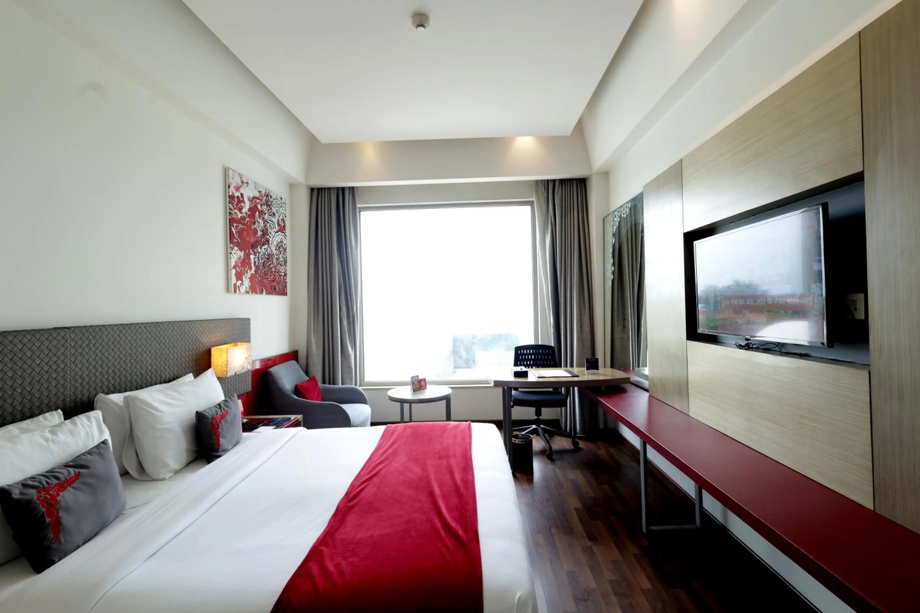 Bed in Ramada by Wyndham Lucknow Hotel and Convention Center