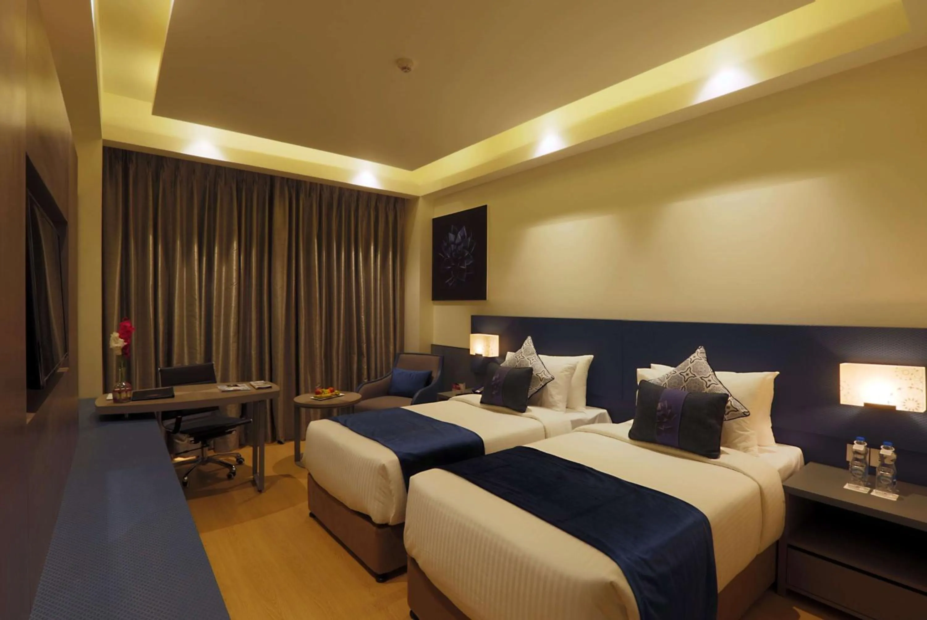 Bed in Ramada by Wyndham Lucknow Hotel and Convention Center