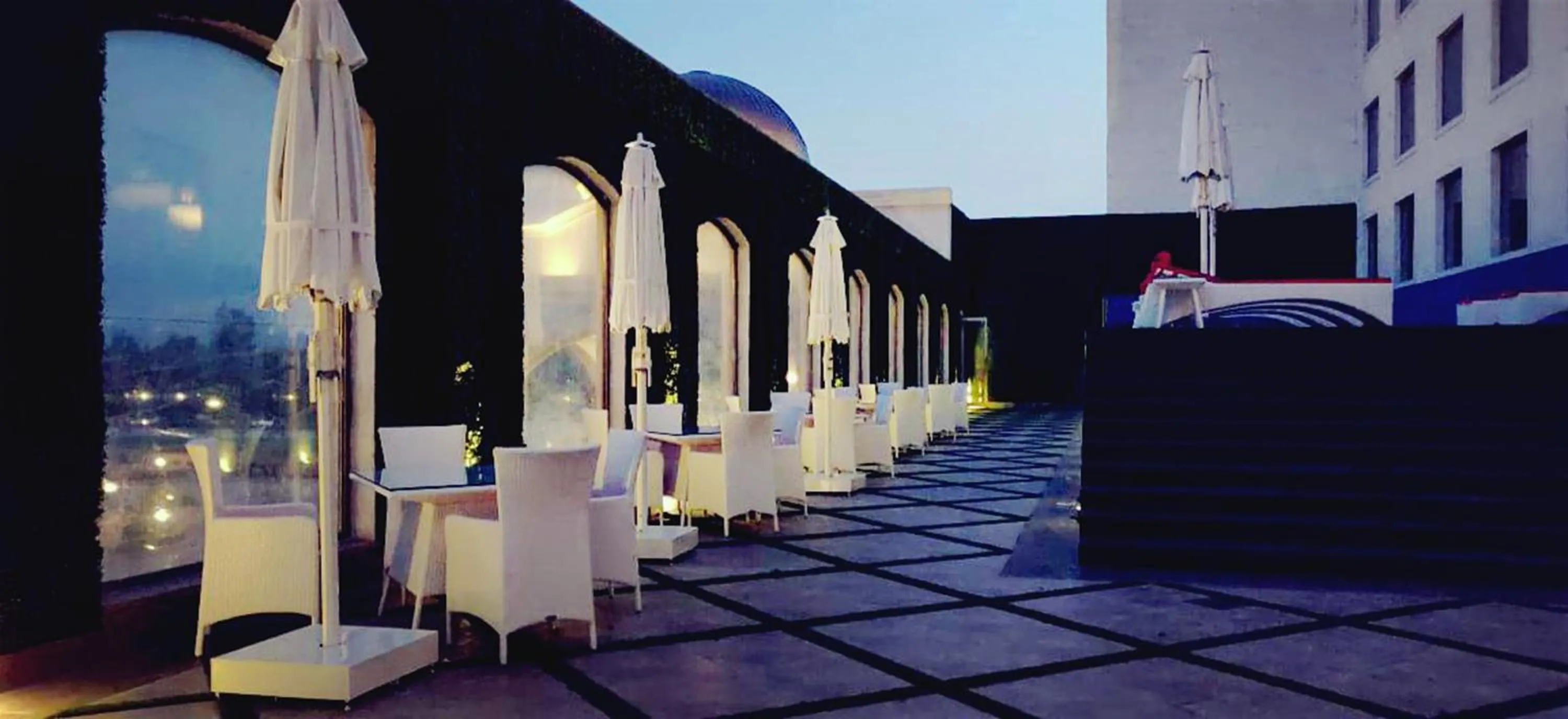 Swimming pool in Ramada by Wyndham Lucknow Hotel and Convention Center