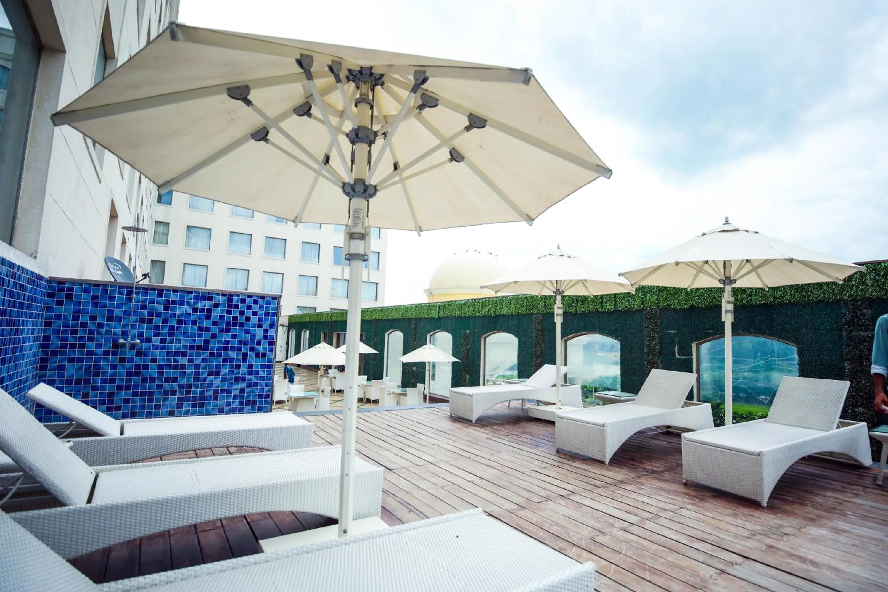 Swimming pool in Ramada by Wyndham Lucknow Hotel and Convention Center