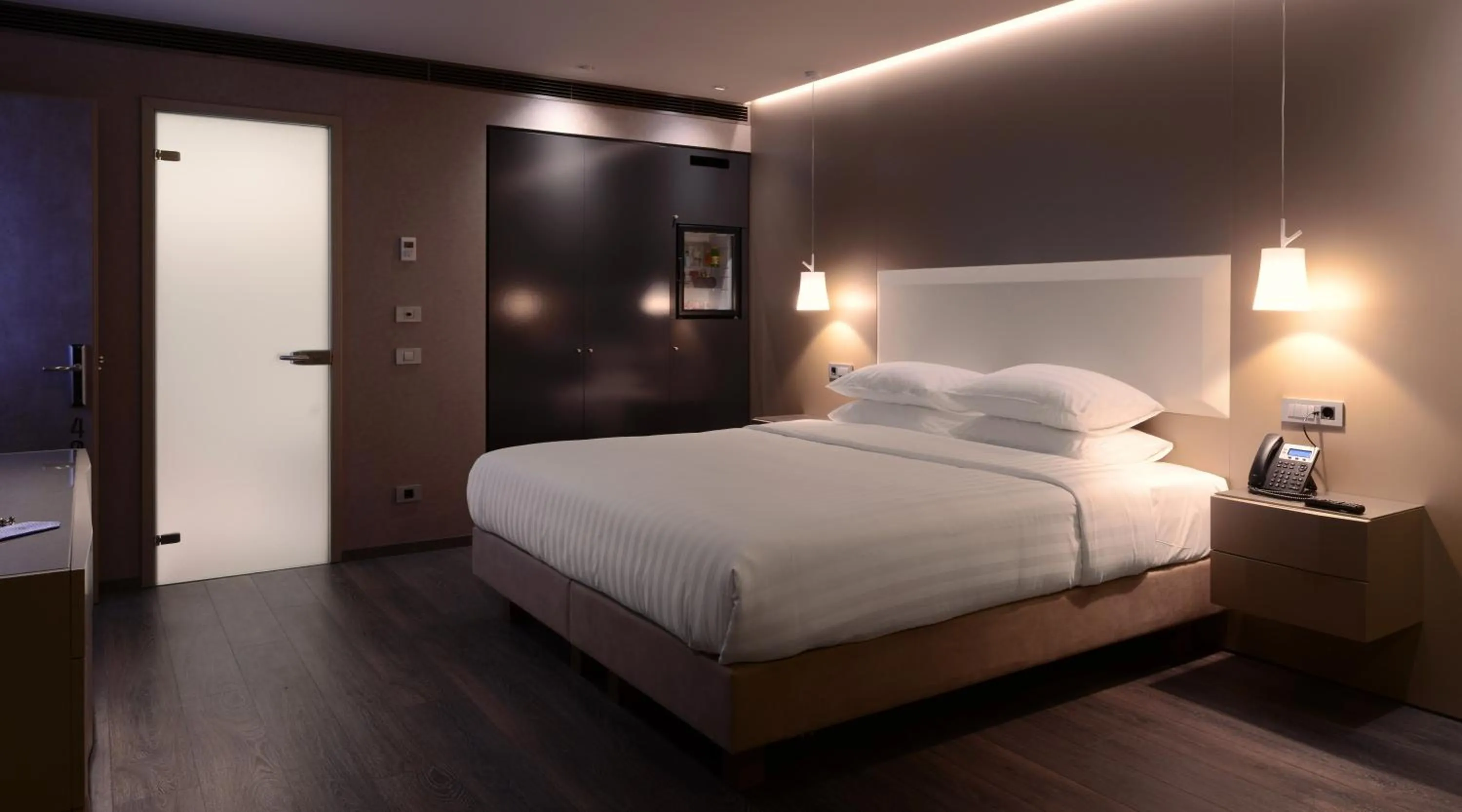 Bed in SAZ City Life Boutique Hotel