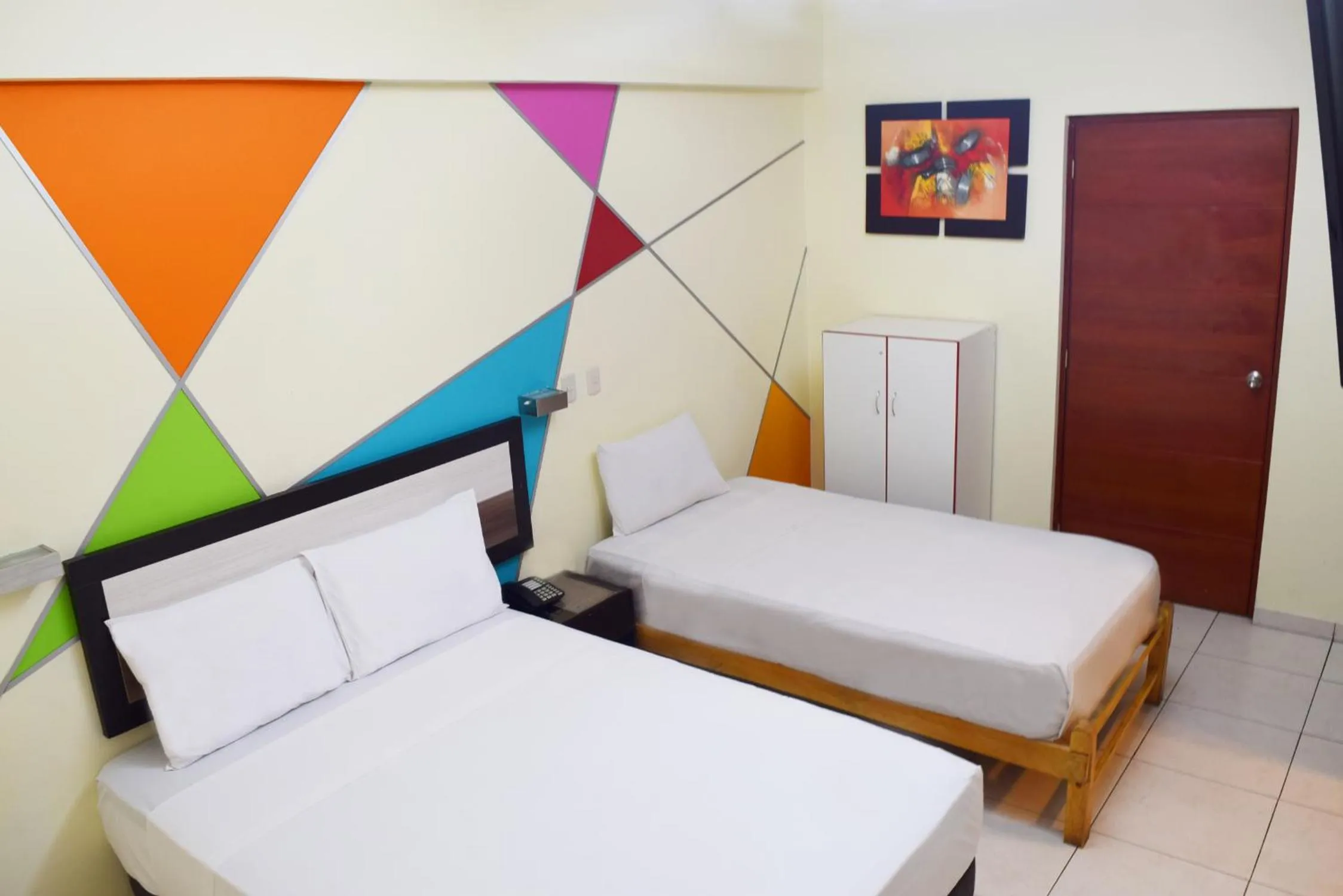 Bed in Hotel Colors Canada