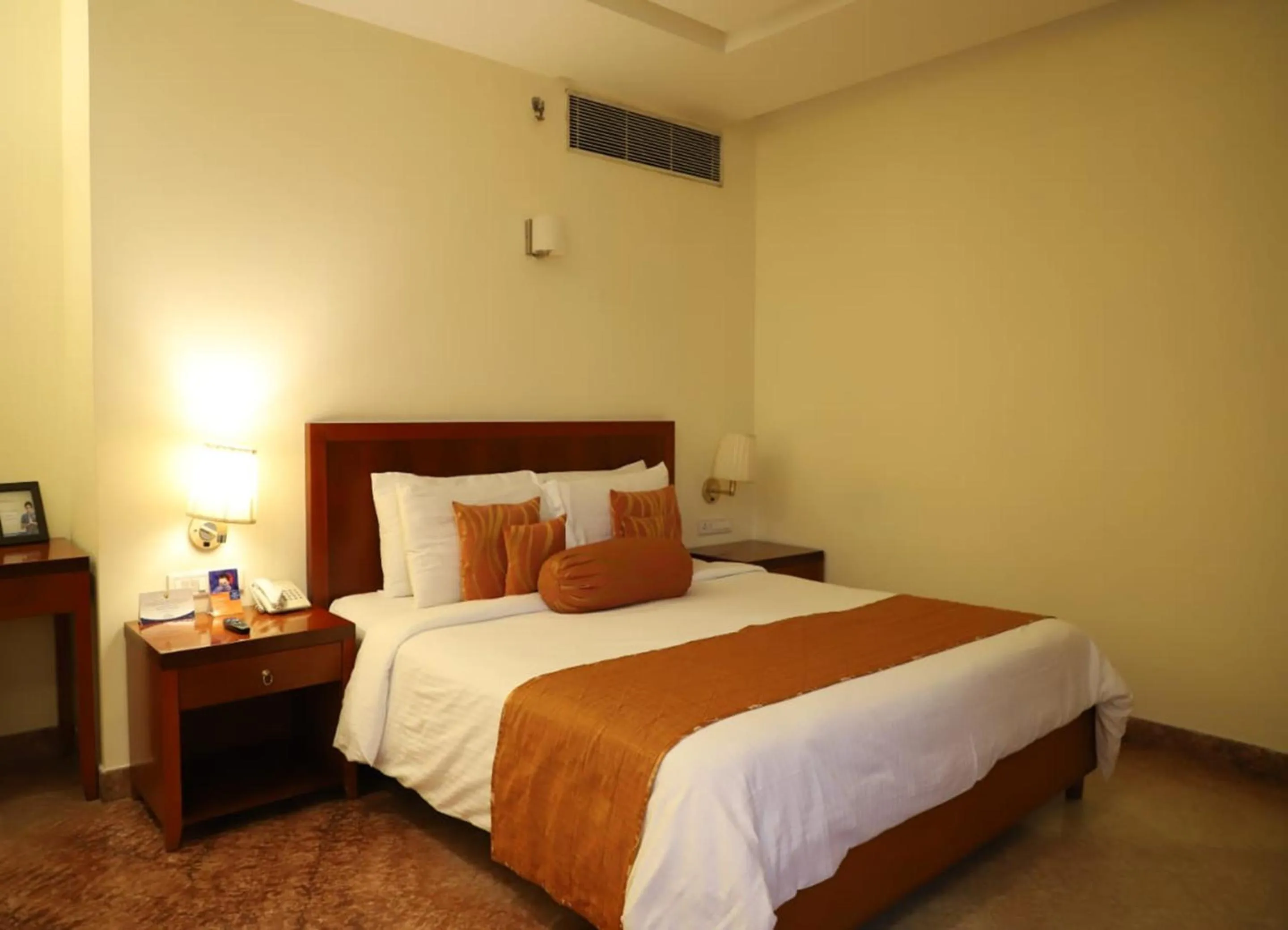 Photo of the whole room, Bed in Royal Sarovar Portico Siliguri
