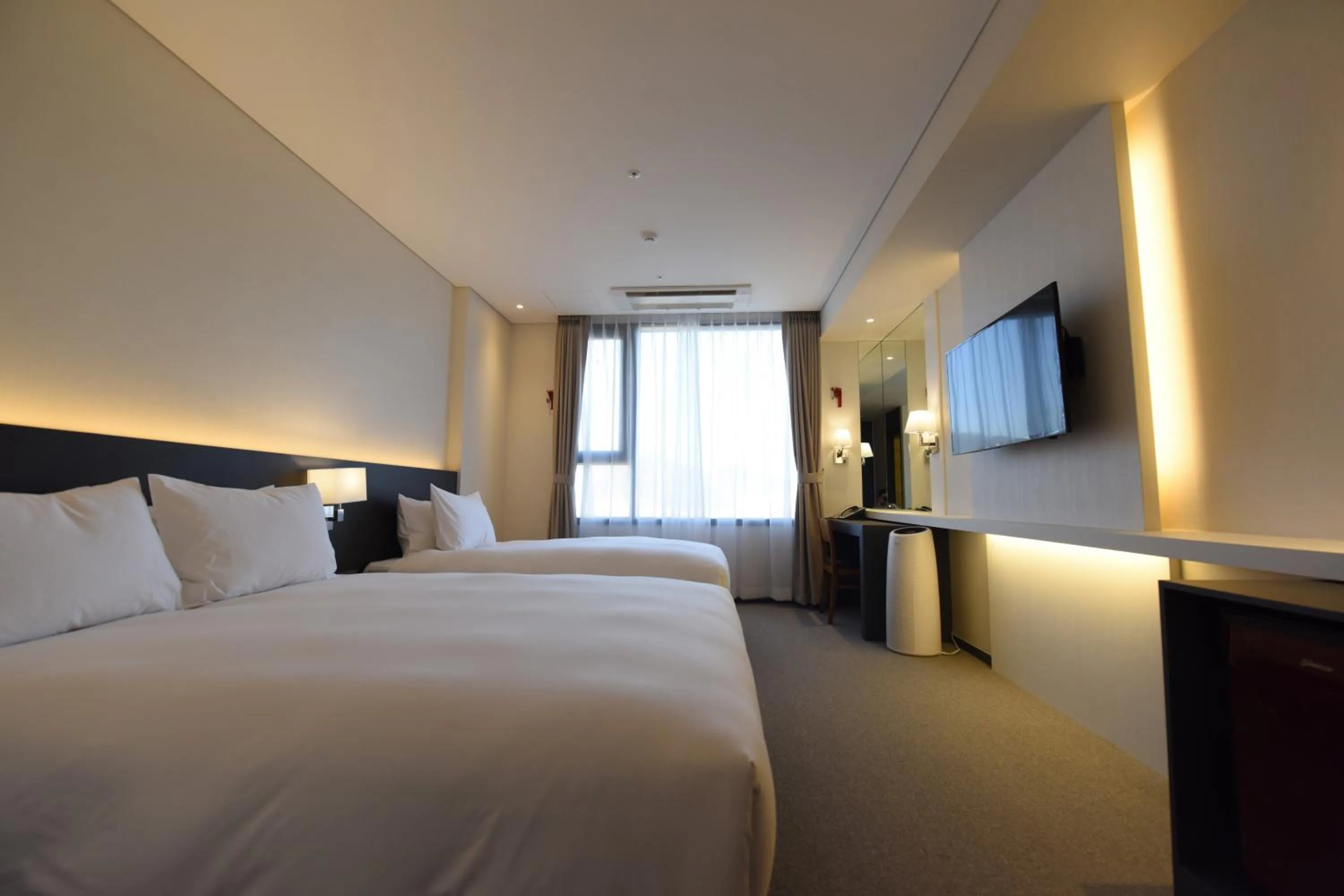 Bed in Geoje Artnouveau Suite Hotel