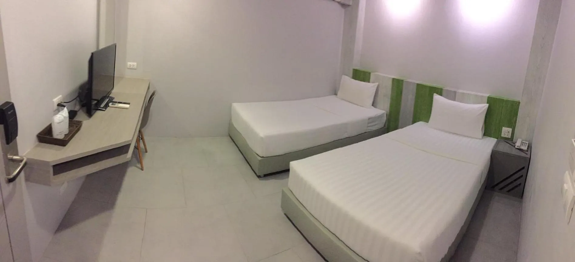 Bed in The Pat Hotel