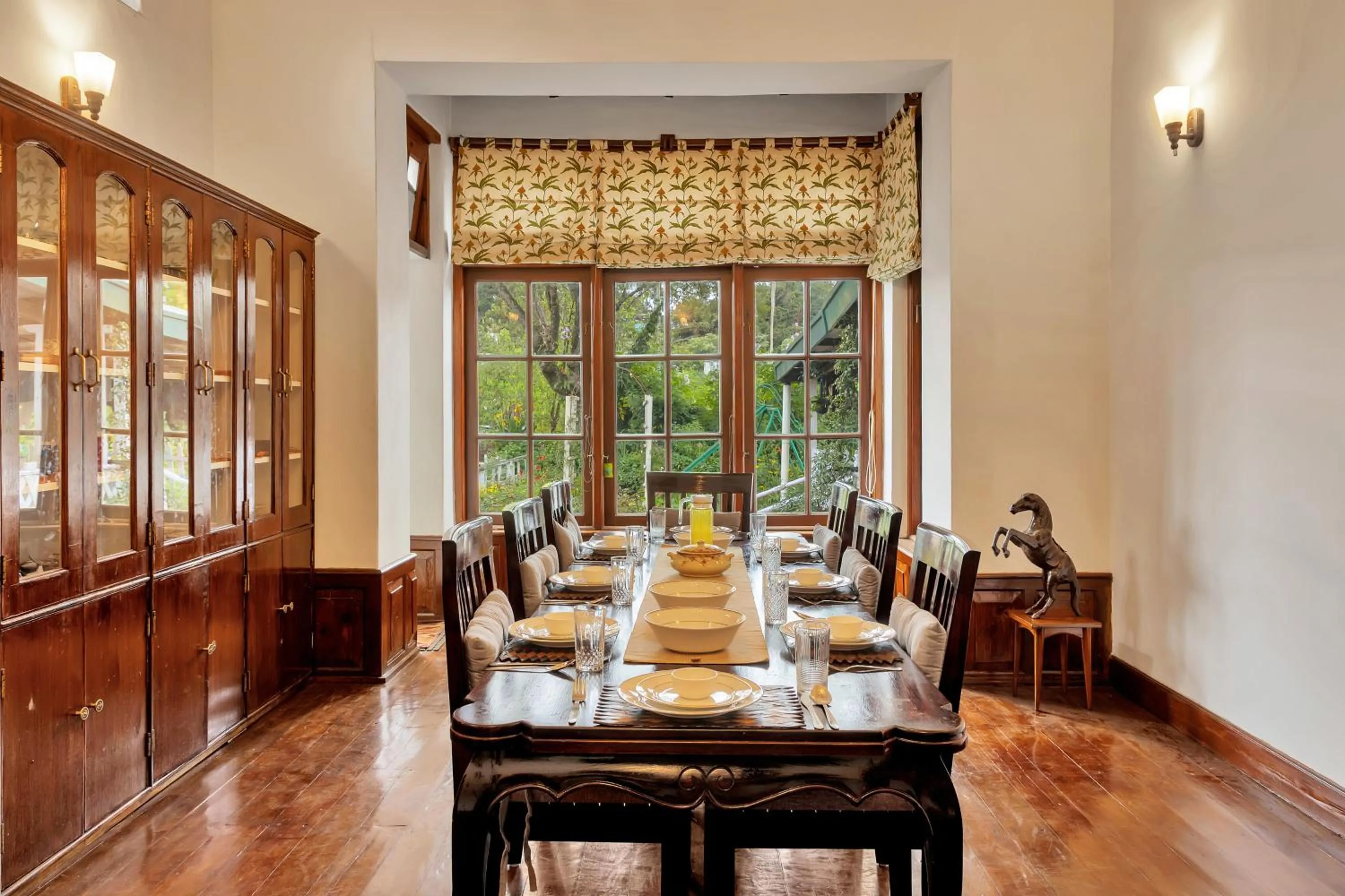 Dining area in SaffronStays Milton Abbott Estate - 2BR colonial-era bungalow with garden, golf course views & bonfire nights near Ooty Golf Club