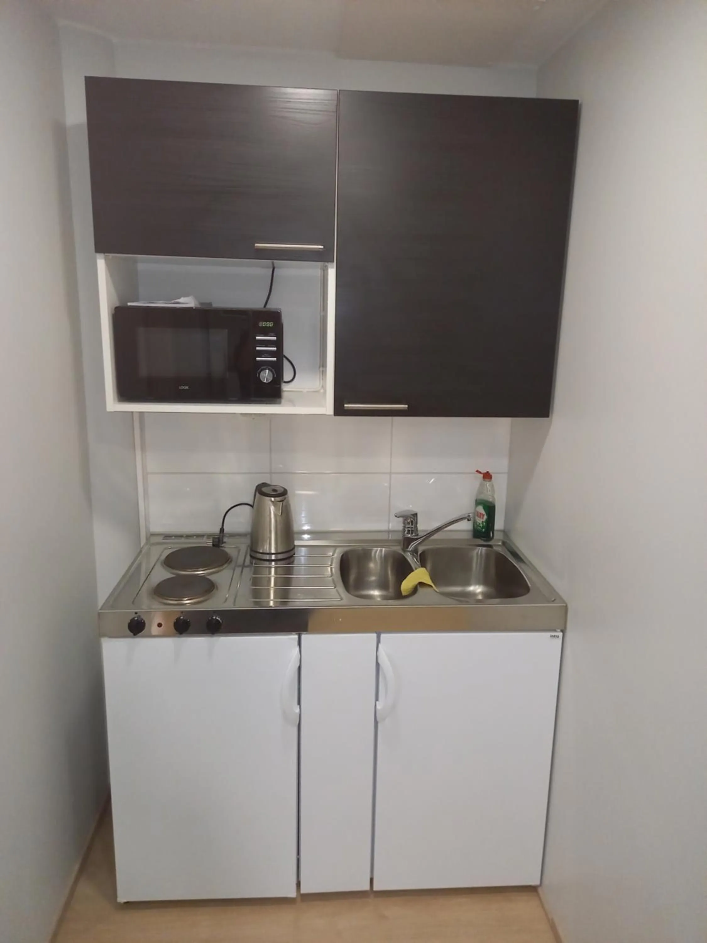 Kitchen or kitchenette in Hotelli Marilyn