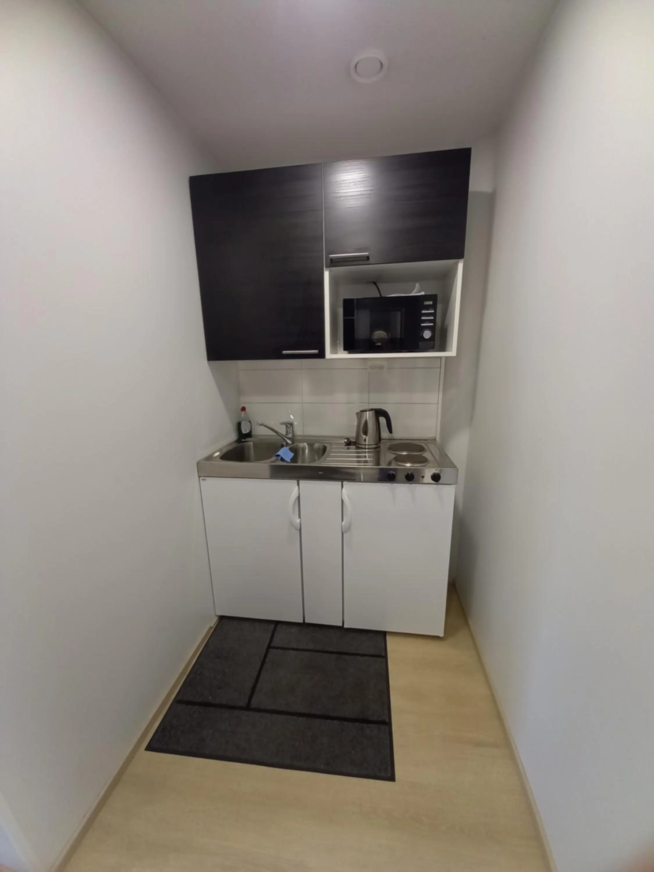 Kitchen or kitchenette in Hotelli Marilyn