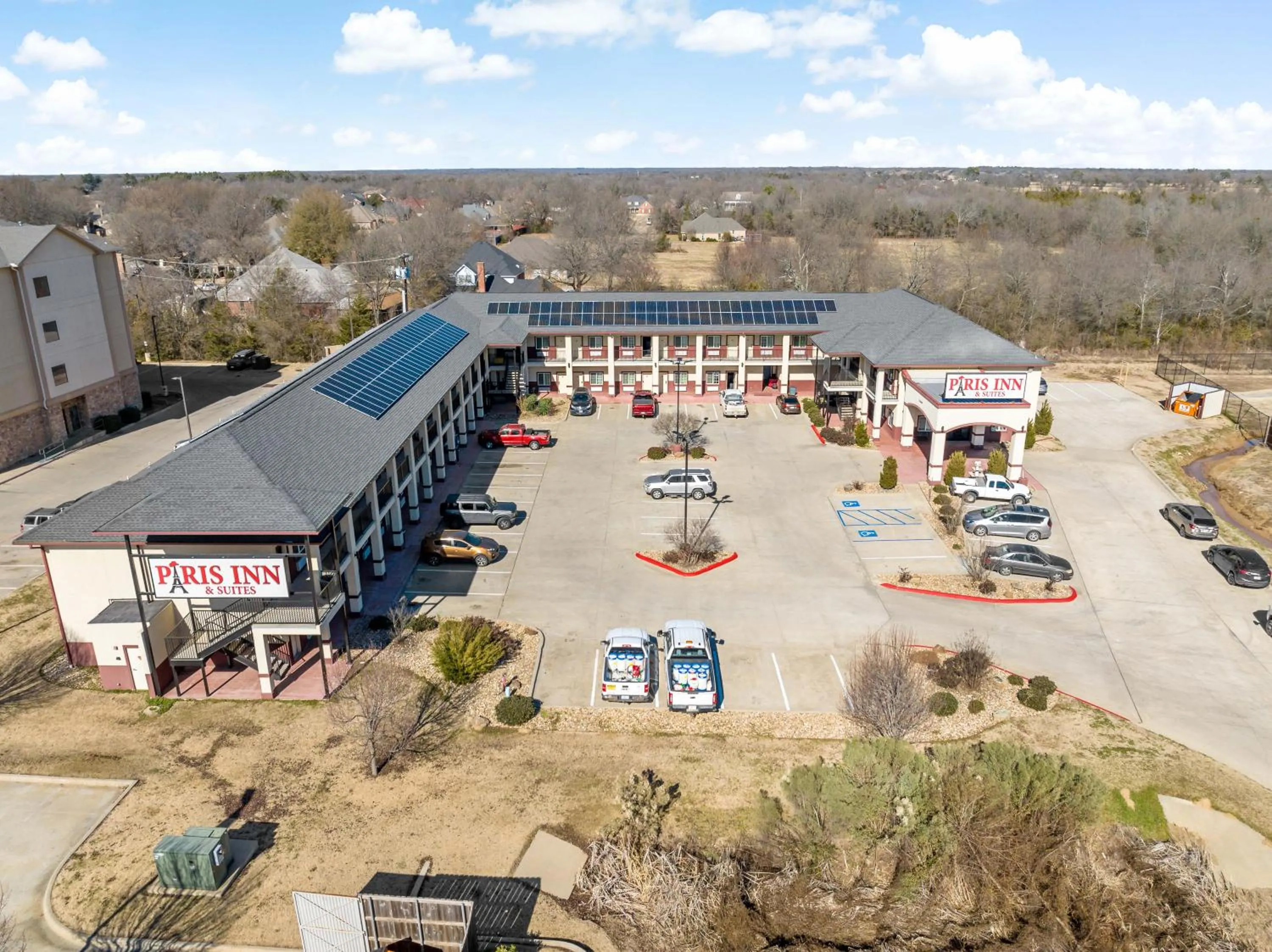 Property building in Paris Inn & Suites