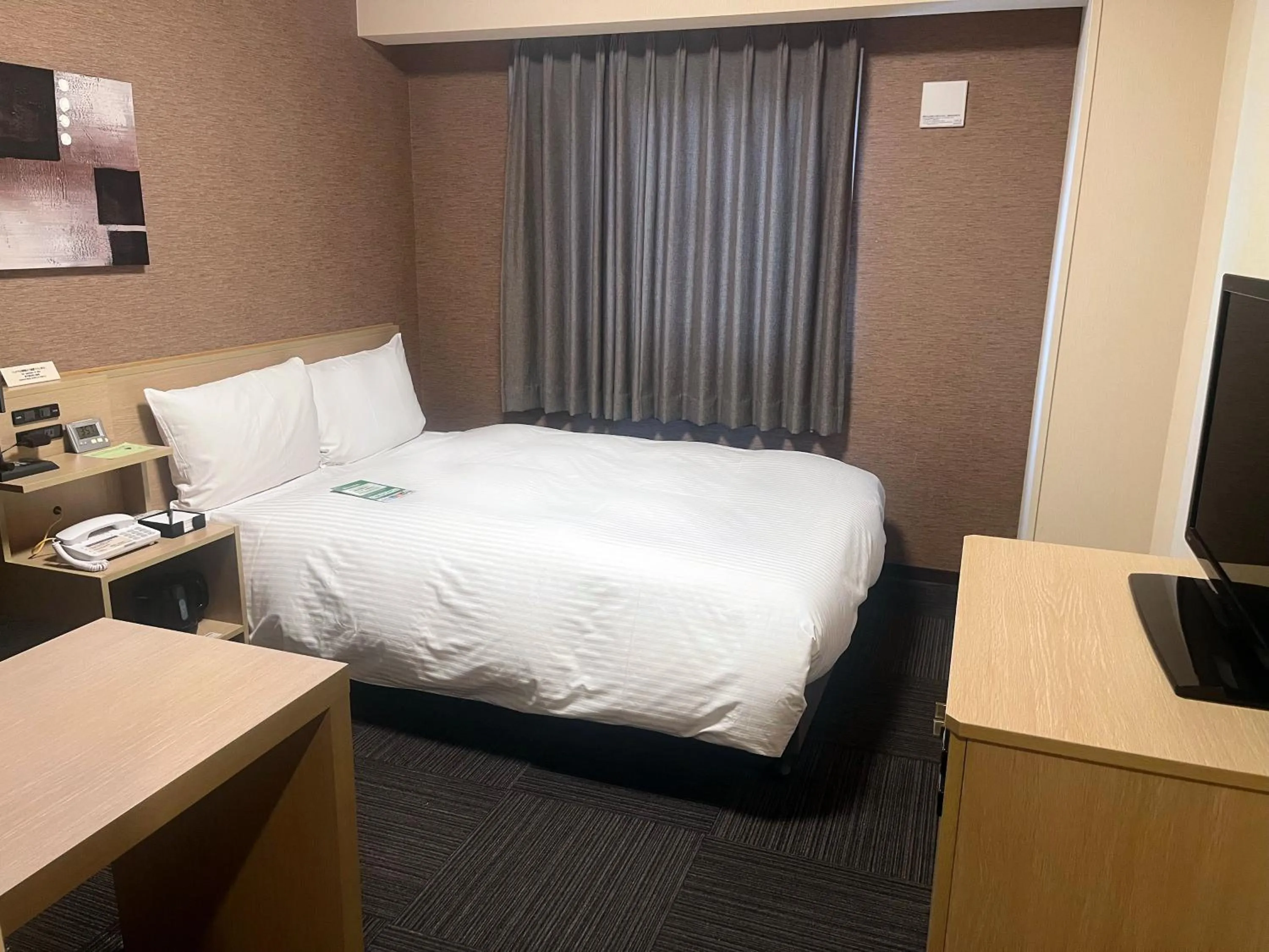 Photo of the whole room, Bed in ​Hotel Route-Inn Ube​