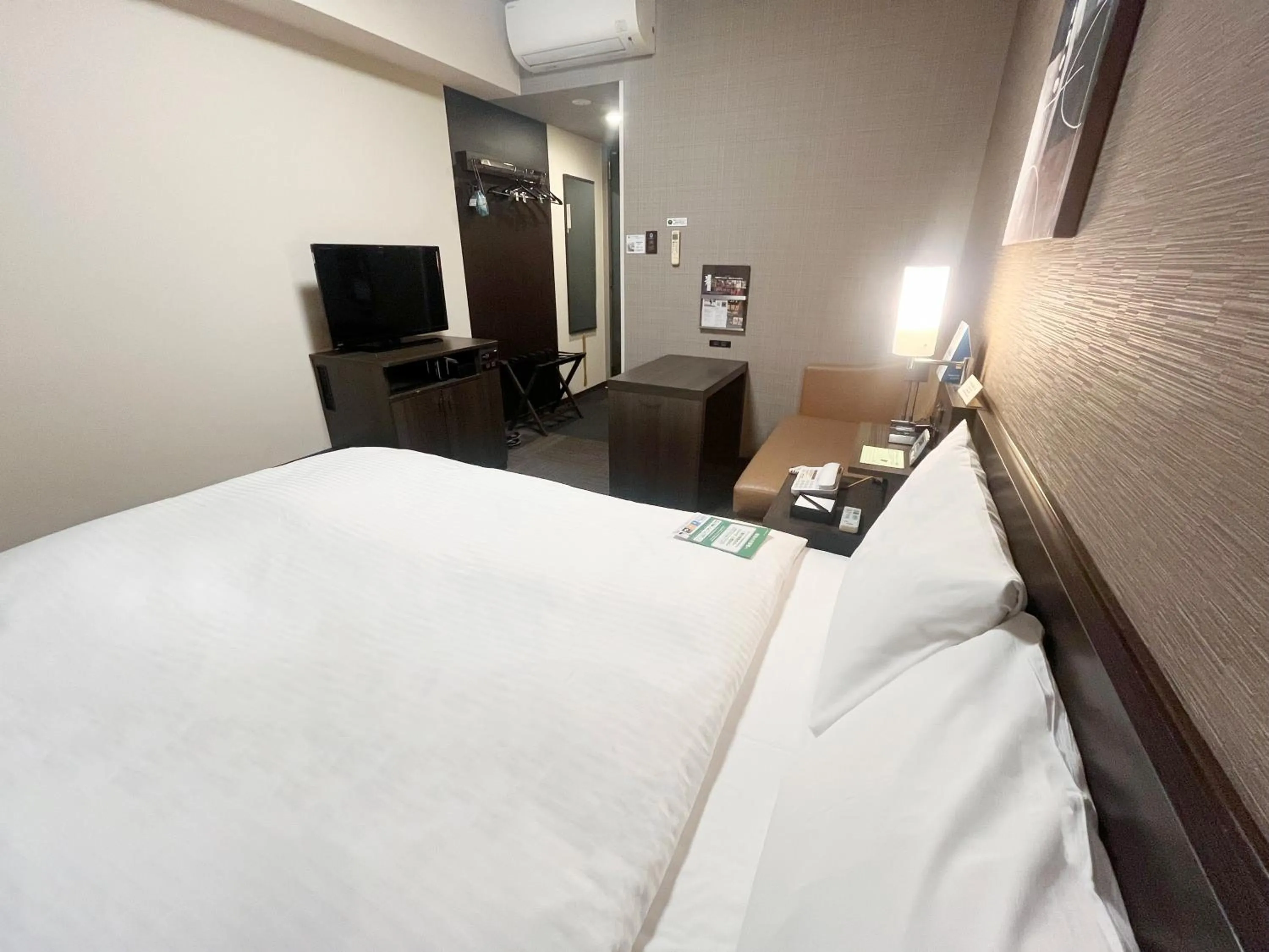 Photo of the whole room, Bed in ​Hotel Route-Inn Ube​