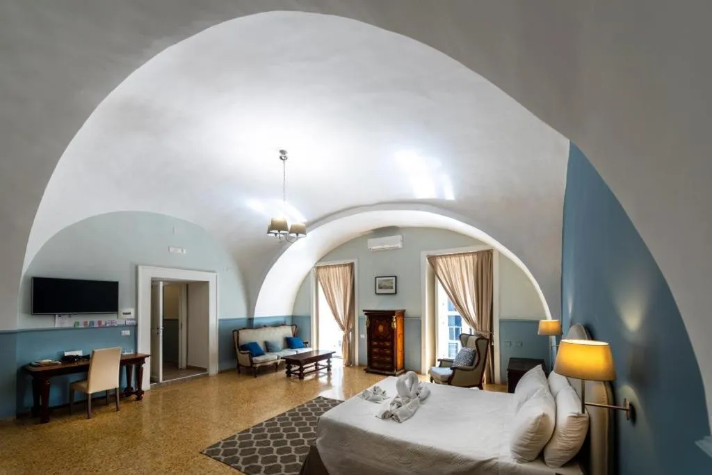 Bed in Aragonese Luxury Rooms
