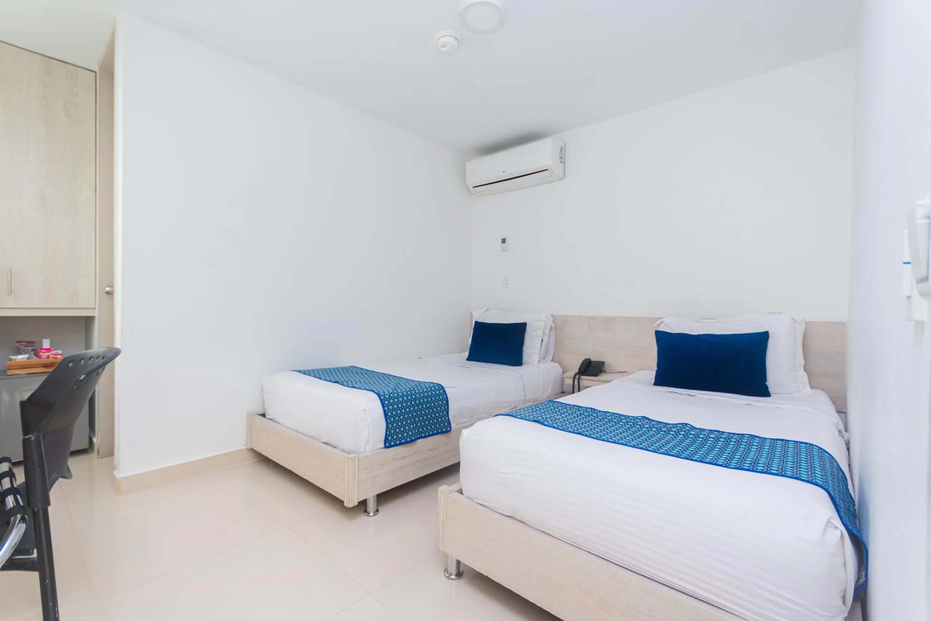 Bed in Hotel Laureles Plaza