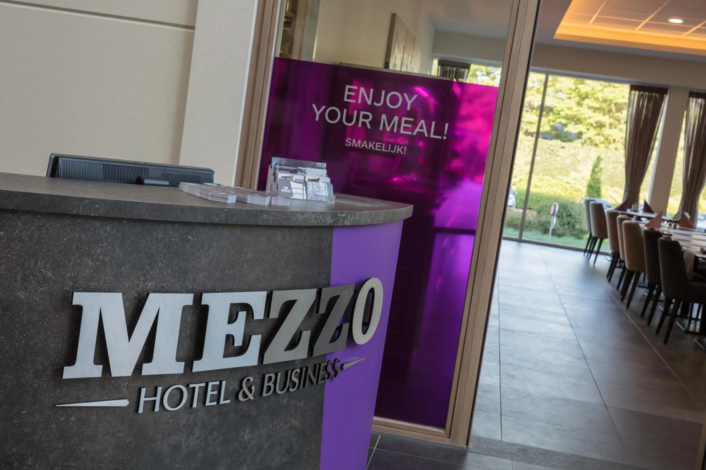 Property logo or sign in Mezzo Hotel & Business