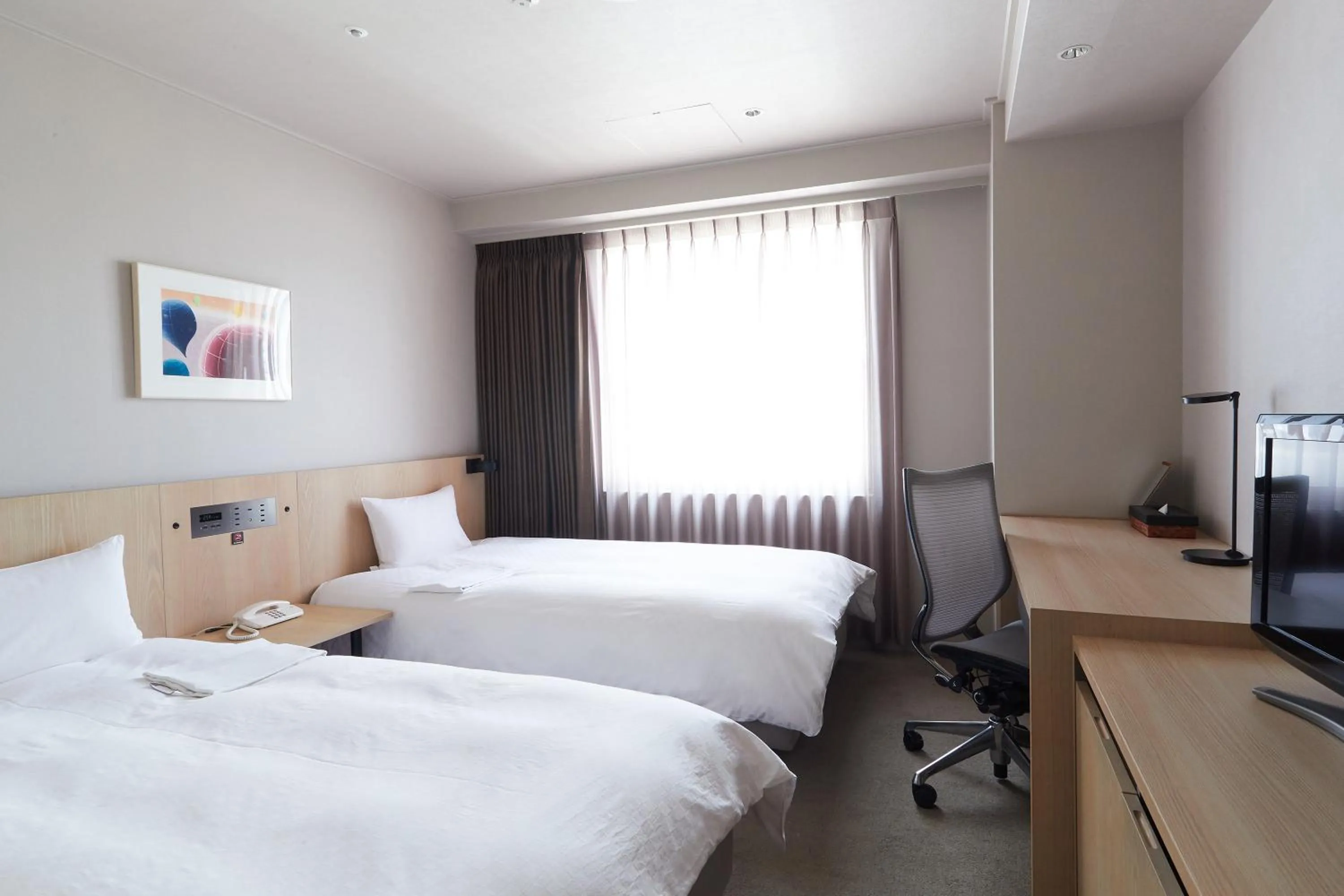 Bed in Rhino Hotel Kyoto