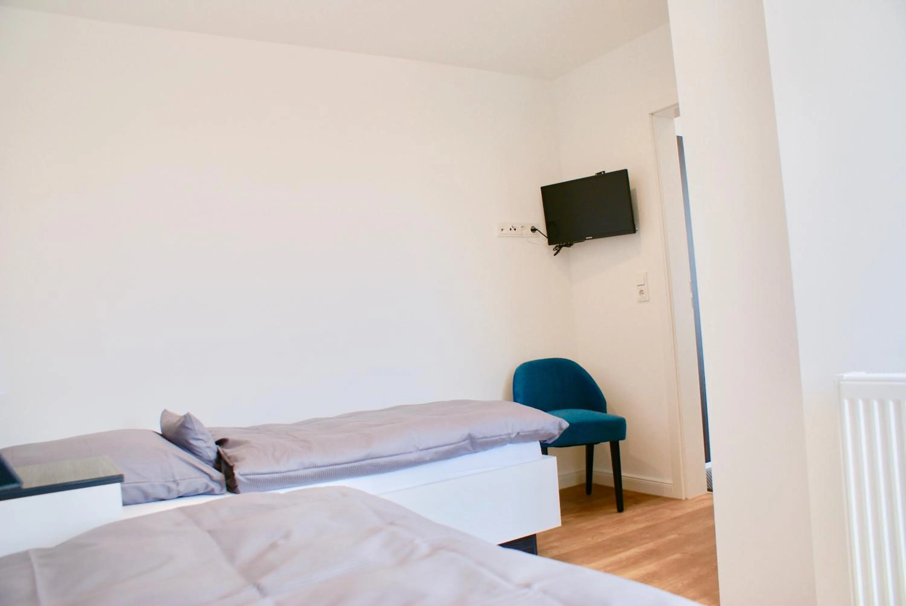 Photo of the whole room, Bed in Deichhotel Rose