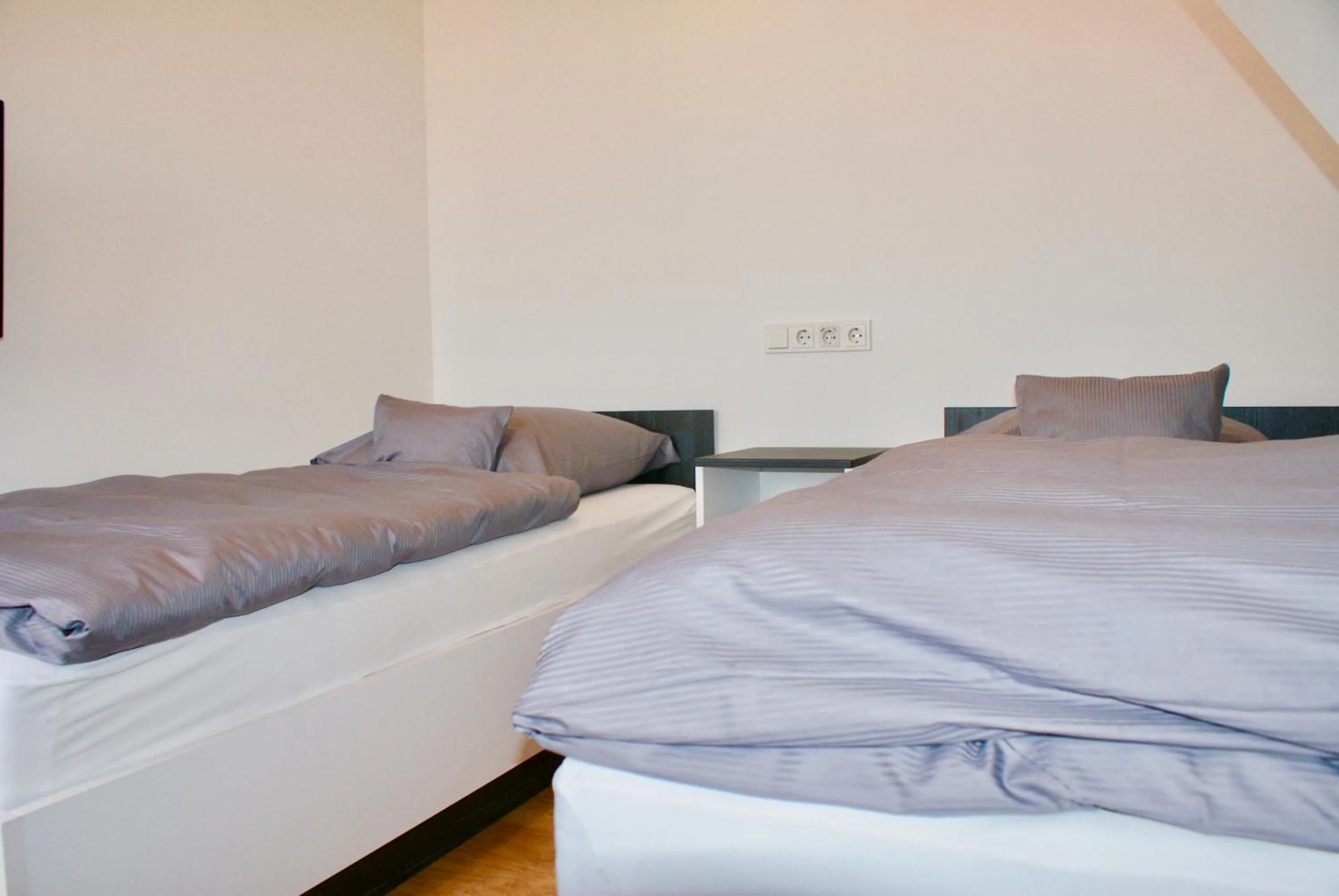 Photo of the whole room, Bed in Deichhotel Rose