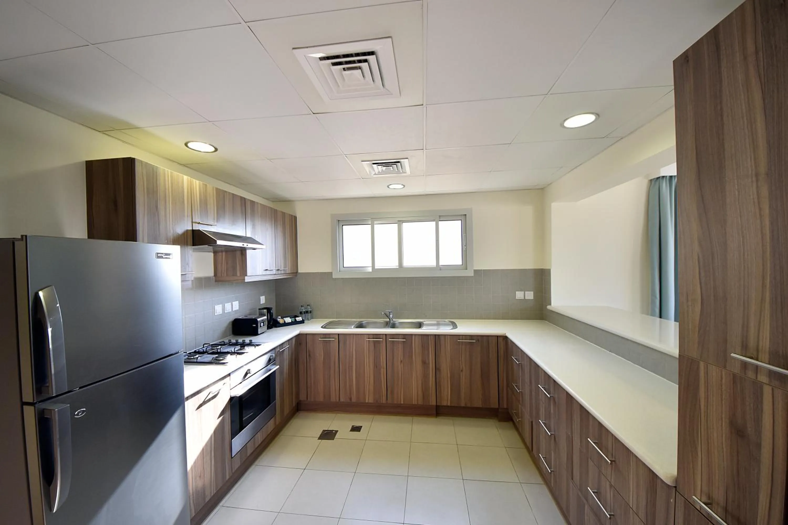 Kitchen or kitchenette in Jannah Hotel Apartments & Villas