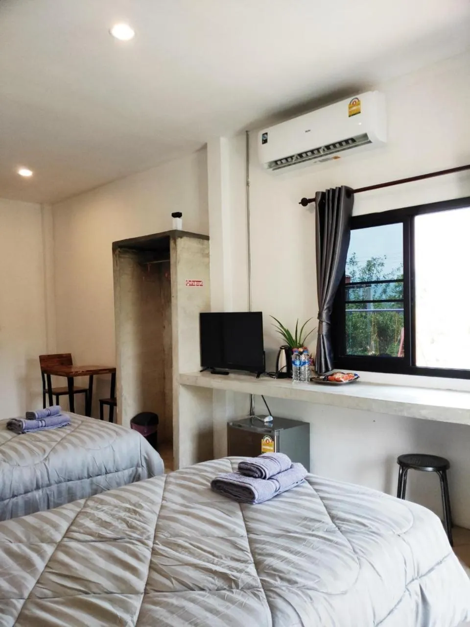 Bed in Santitham Home Farm Stay