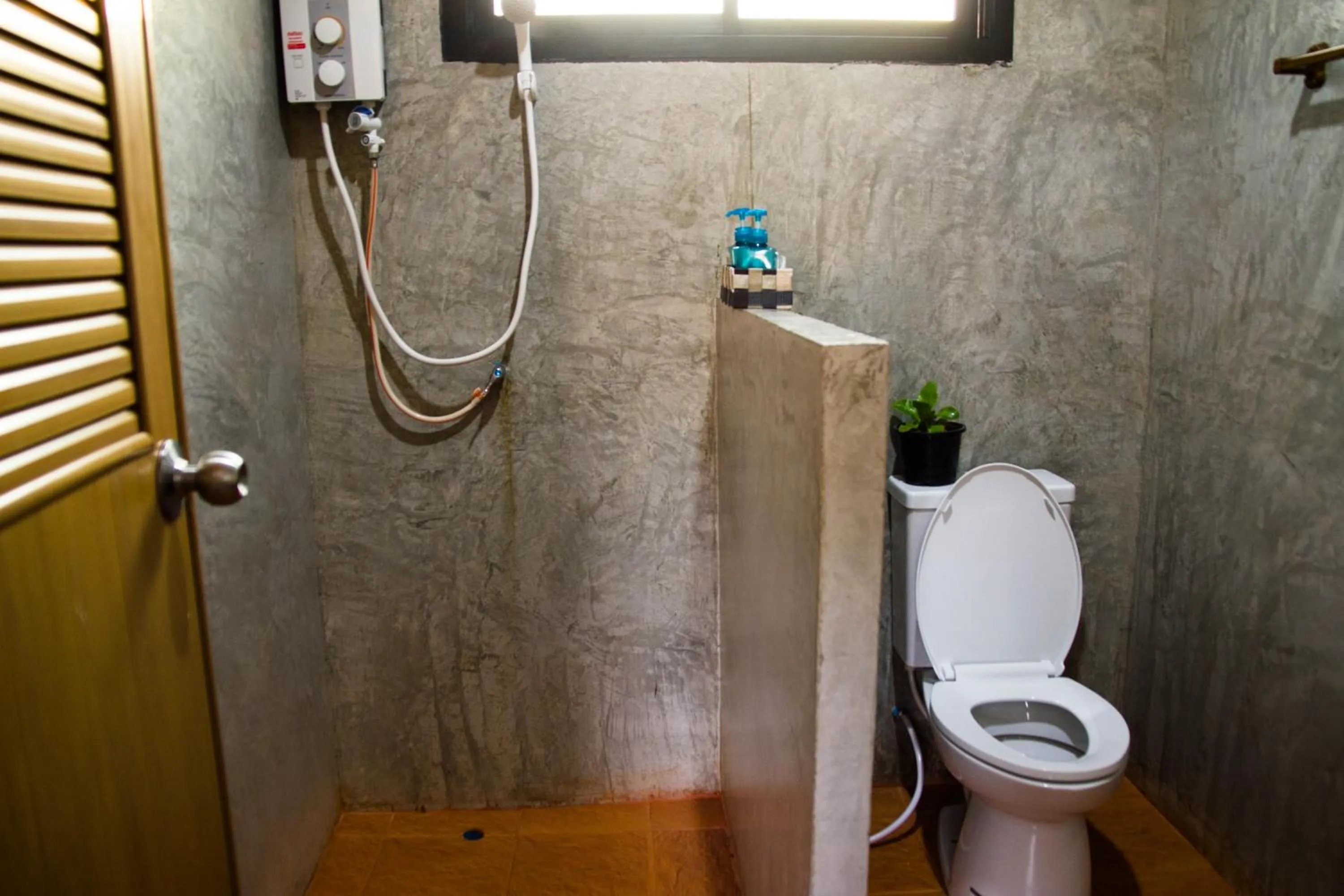 Photo of the whole room in Santitham Home Farm Stay