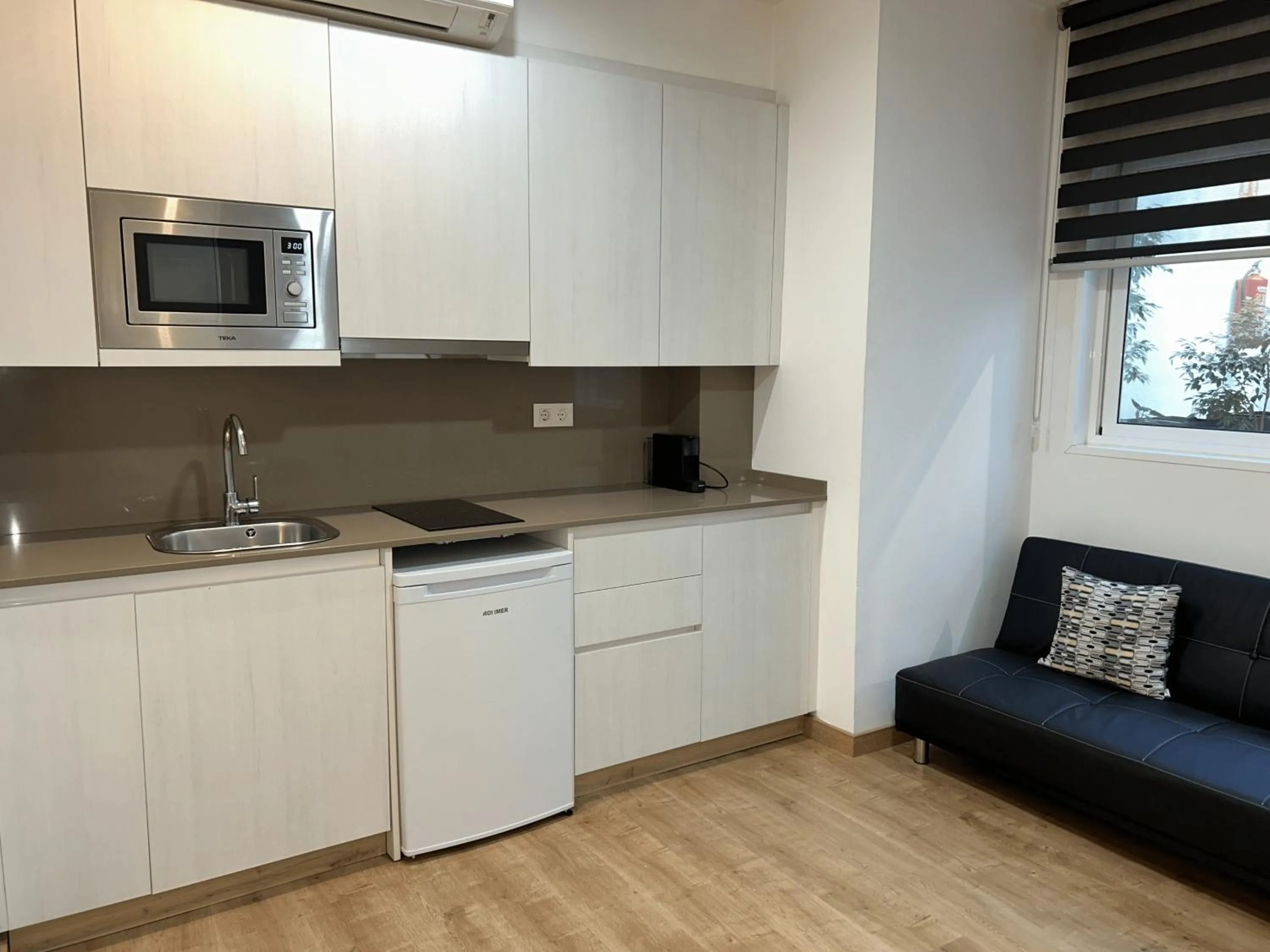 Kitchen or kitchenette in Apartahotel Baldiri